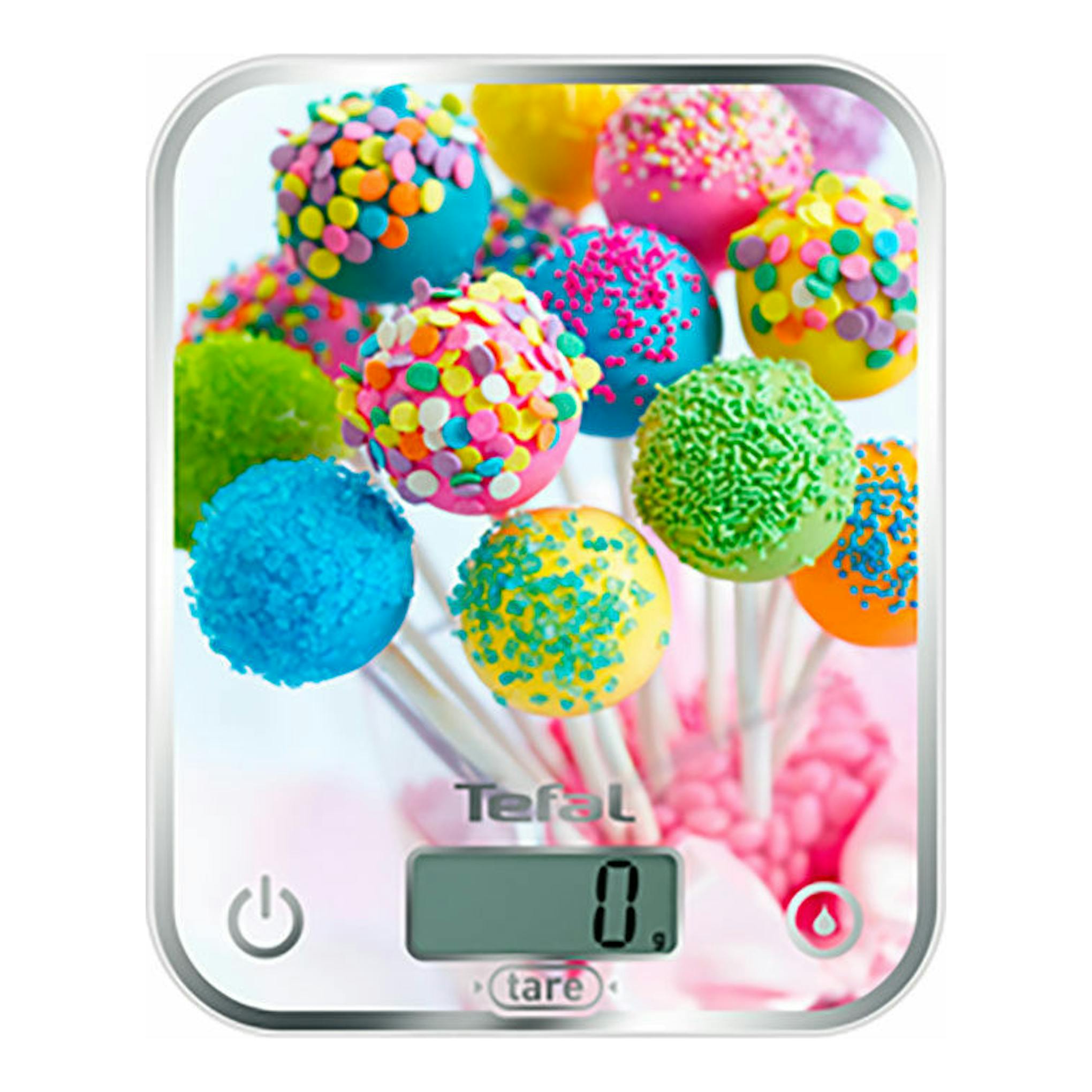 Balanza de cocina Tefal BC5121V0/1, vista frontal, blanca, con diseño de cake pops y pantalla digital.