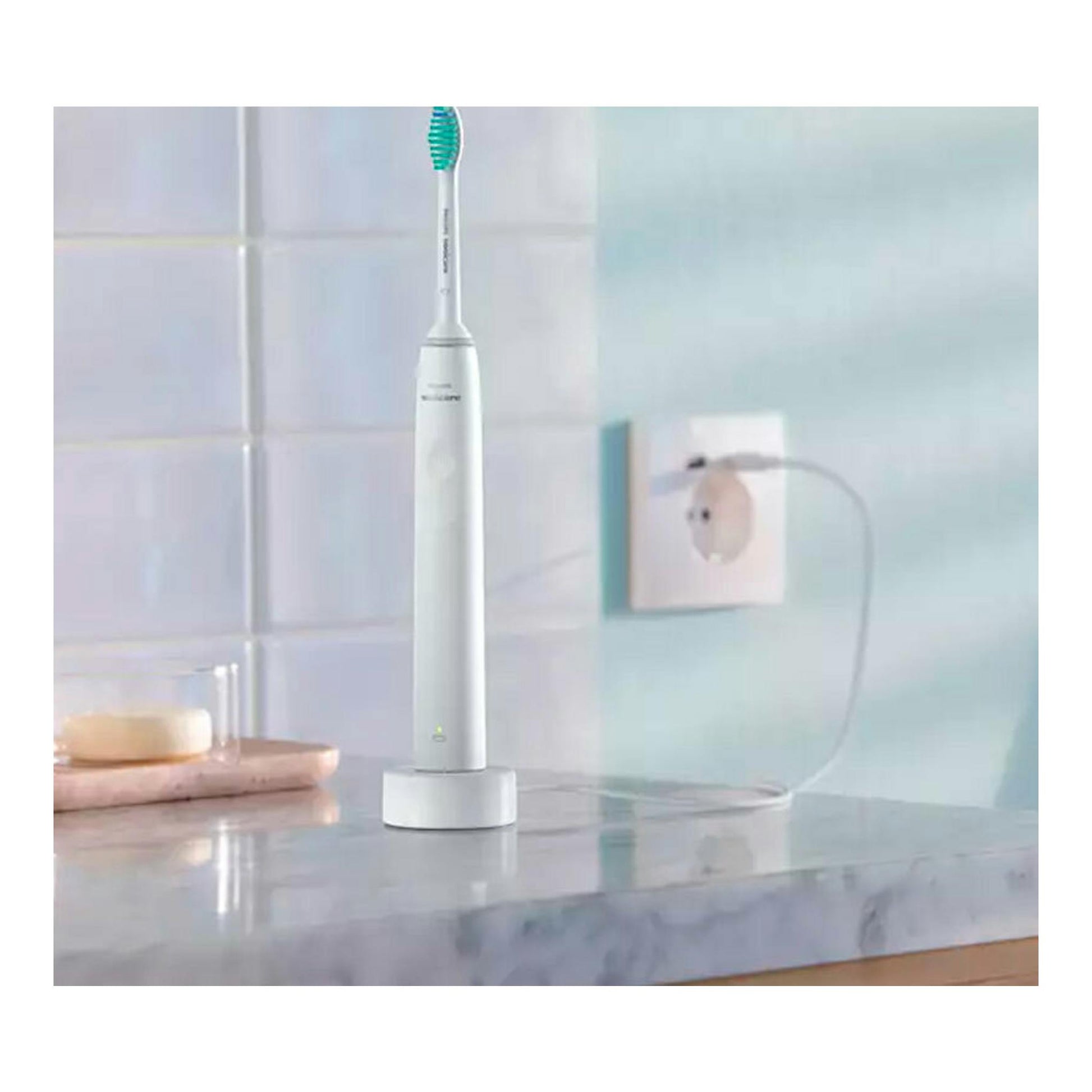 Cepillo dental eléctrico Philips HX3651/13 blanco sobre base de carga, vista frontal, en encimera de baño.
