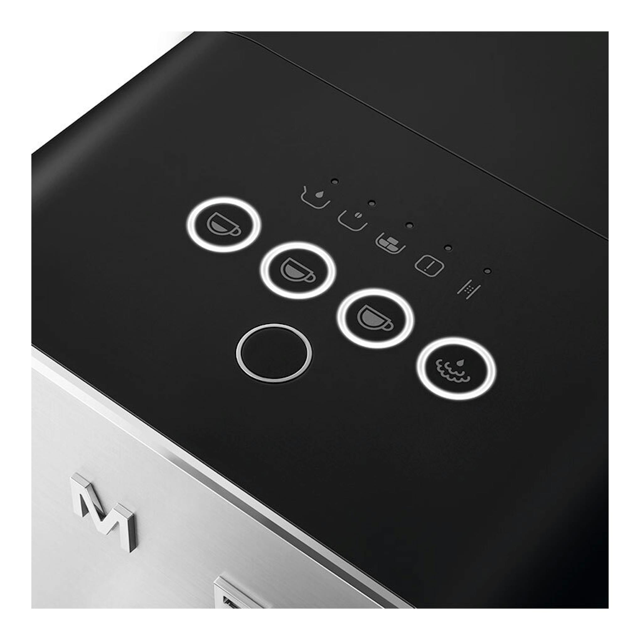 Cafetera superautomática Smeg BCC12BLMEU, vista cenital en ángulo, negra y acero inoxidable, con botones iluminados.