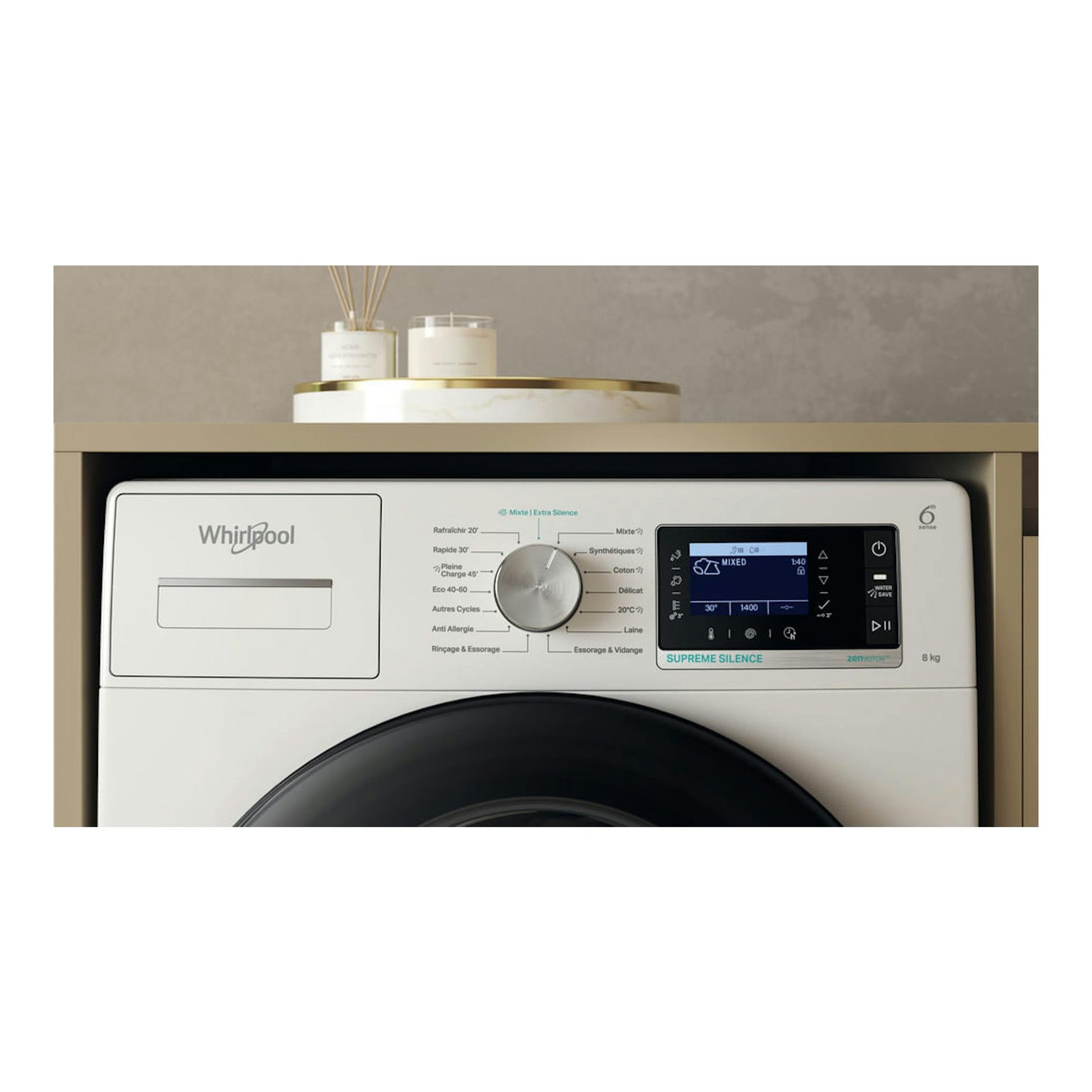 Lavadora Whirlpool blanca, vista frontal parcial, con panel digital y selector central.