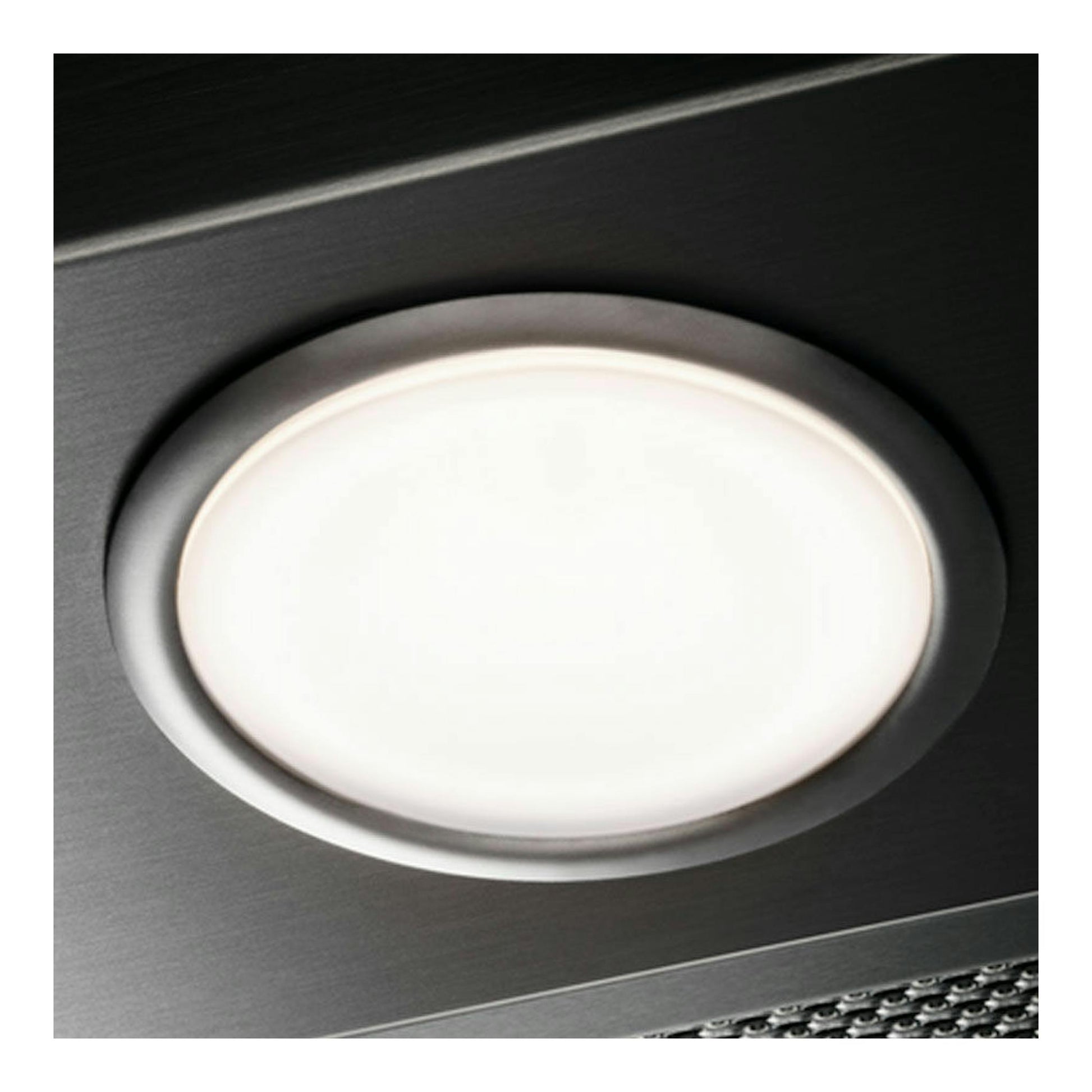 Campana integrada Electrolux EFP129X inox, vista en detalle del foco circular sobre acero inoxidable.
