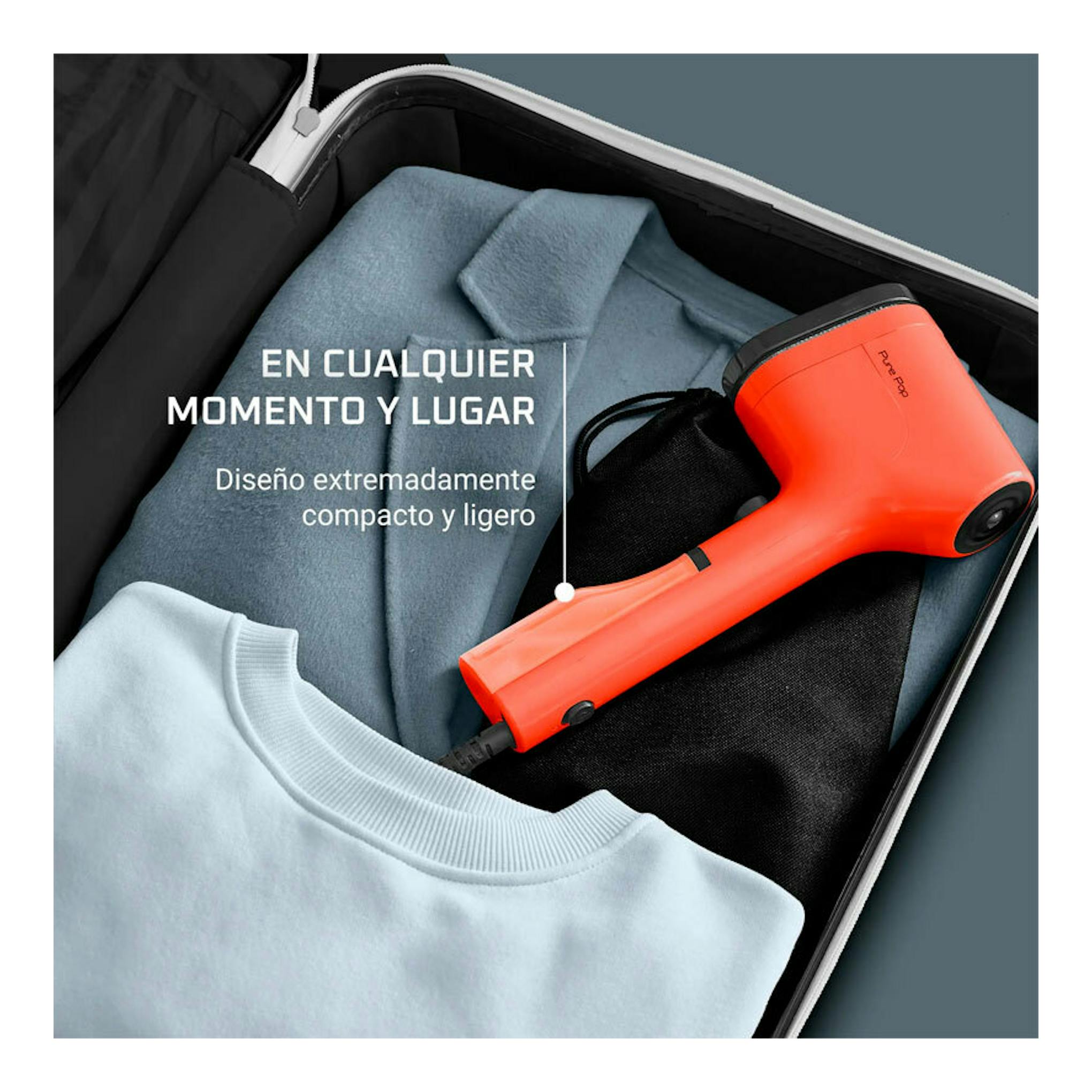 Cepillo vapor Rowenta DR2022D1 naranja en una maleta con ropa, vista superior.