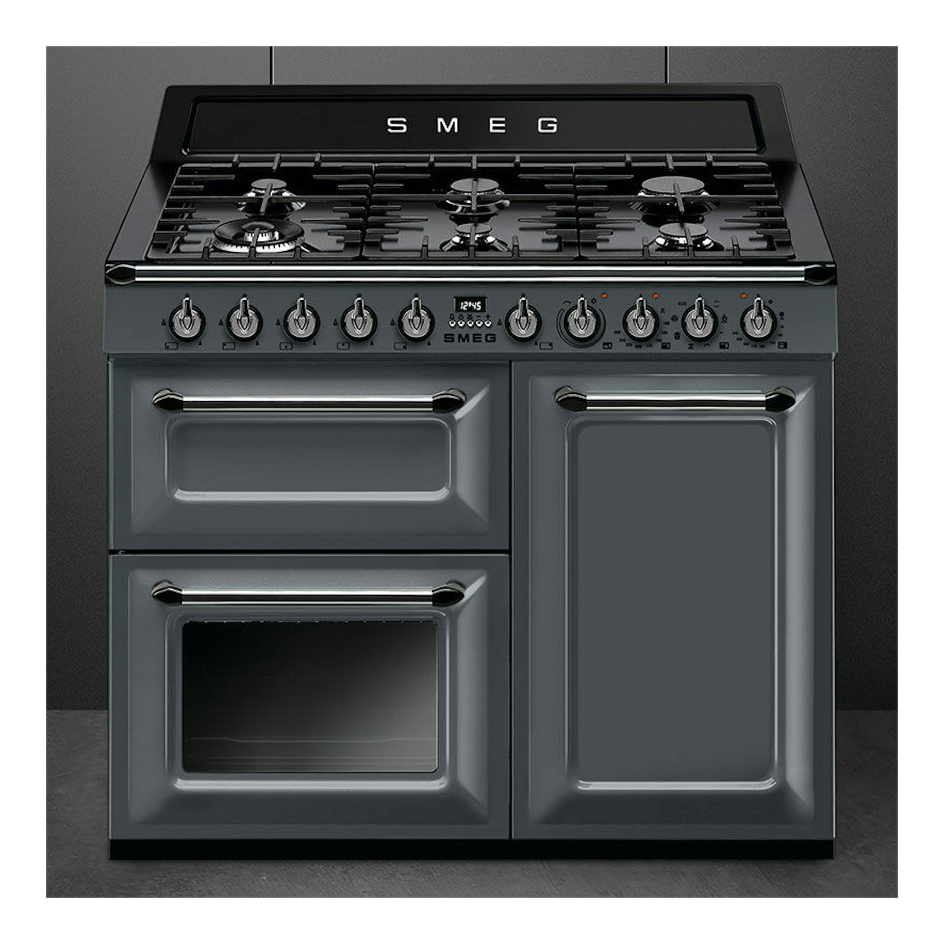 Cocina Smeg TR103GR gris antracita, vista frontal, con cuatro hornillos y doble horno.