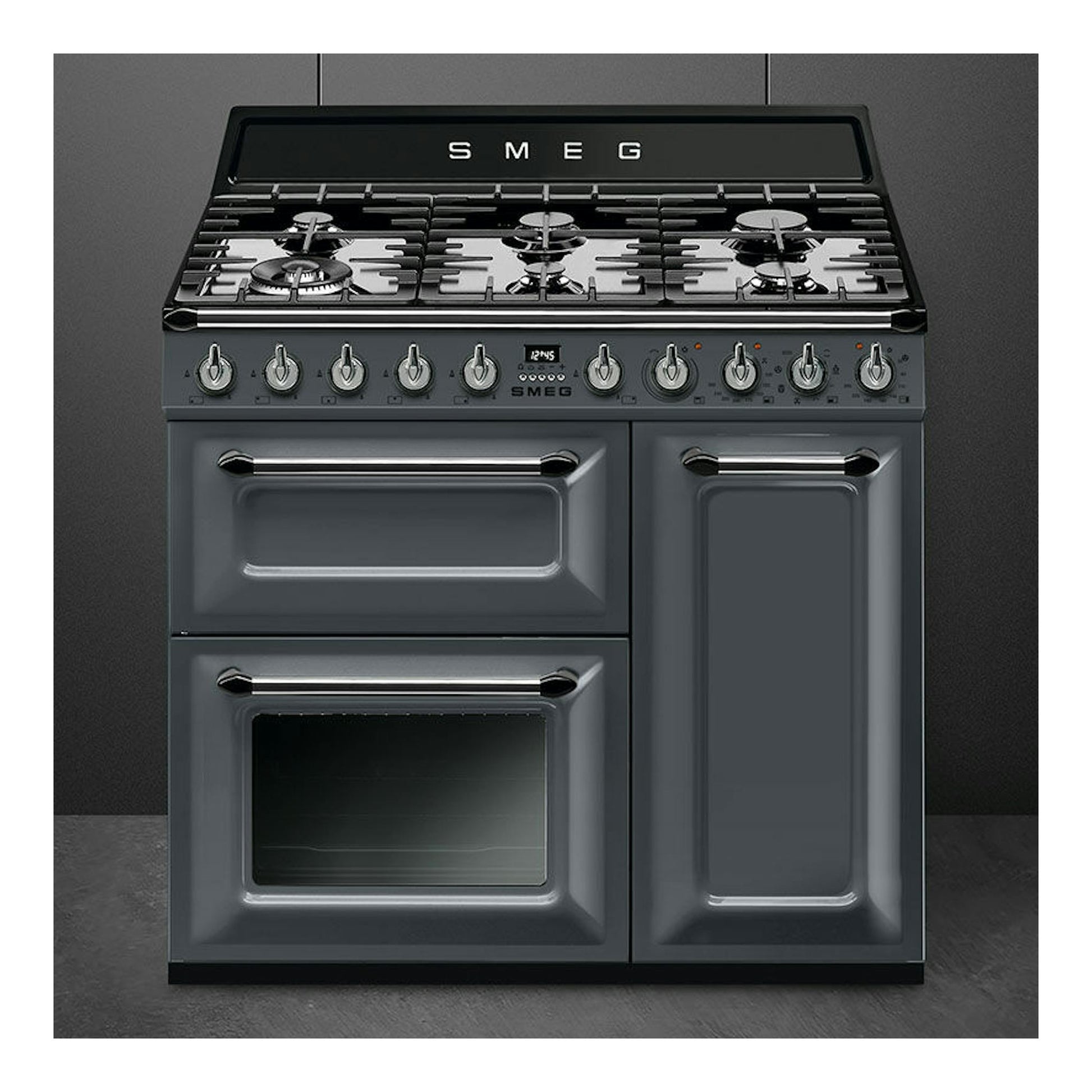 Cocina Smeg TR93GR de 90 cm, gris antracita, vista frontal, con placa de gas y tres hornos.