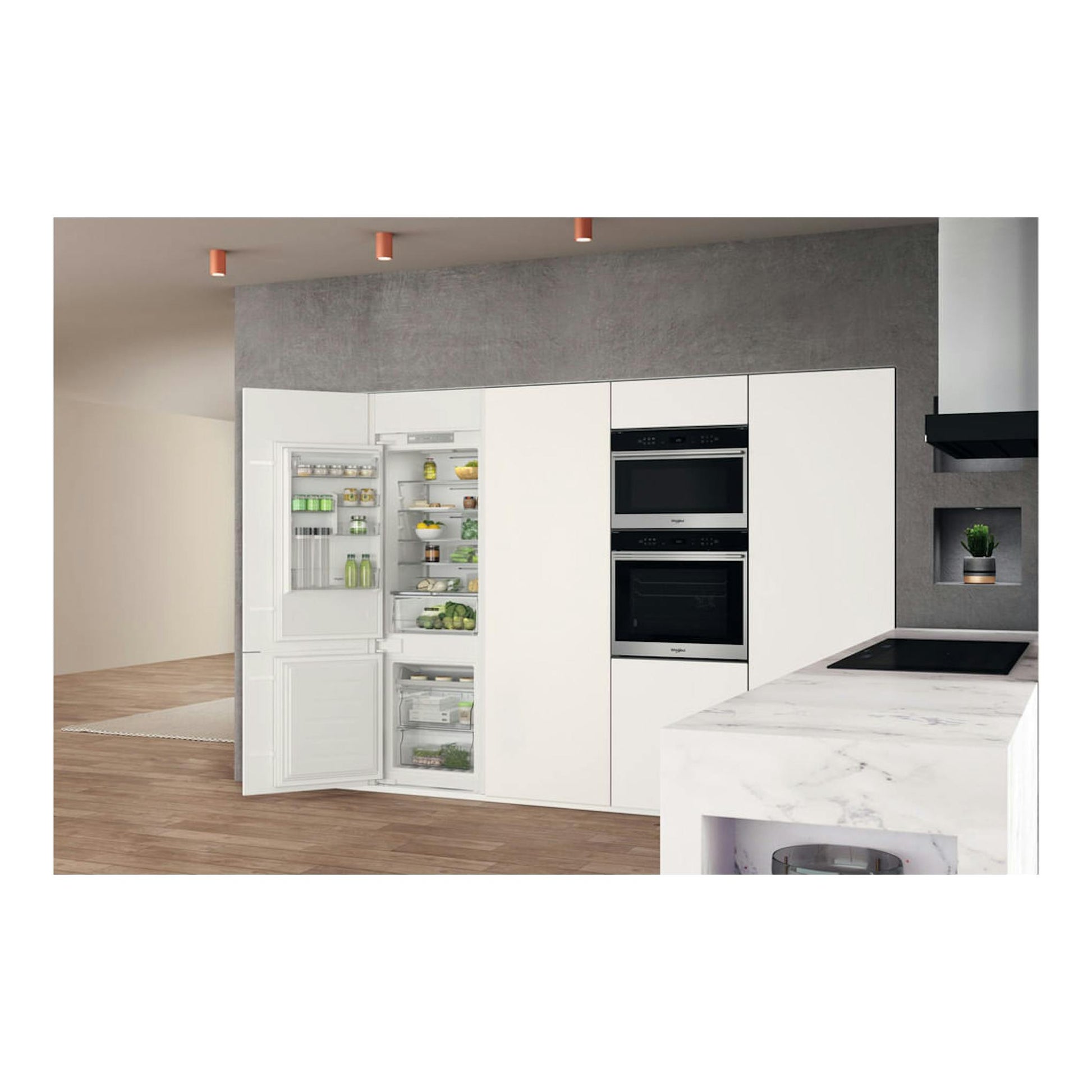 Frigorífico integrable Whirlpool WHC18 T311 blanco, vista frontal con la puerta abierta, en una cocina moderna