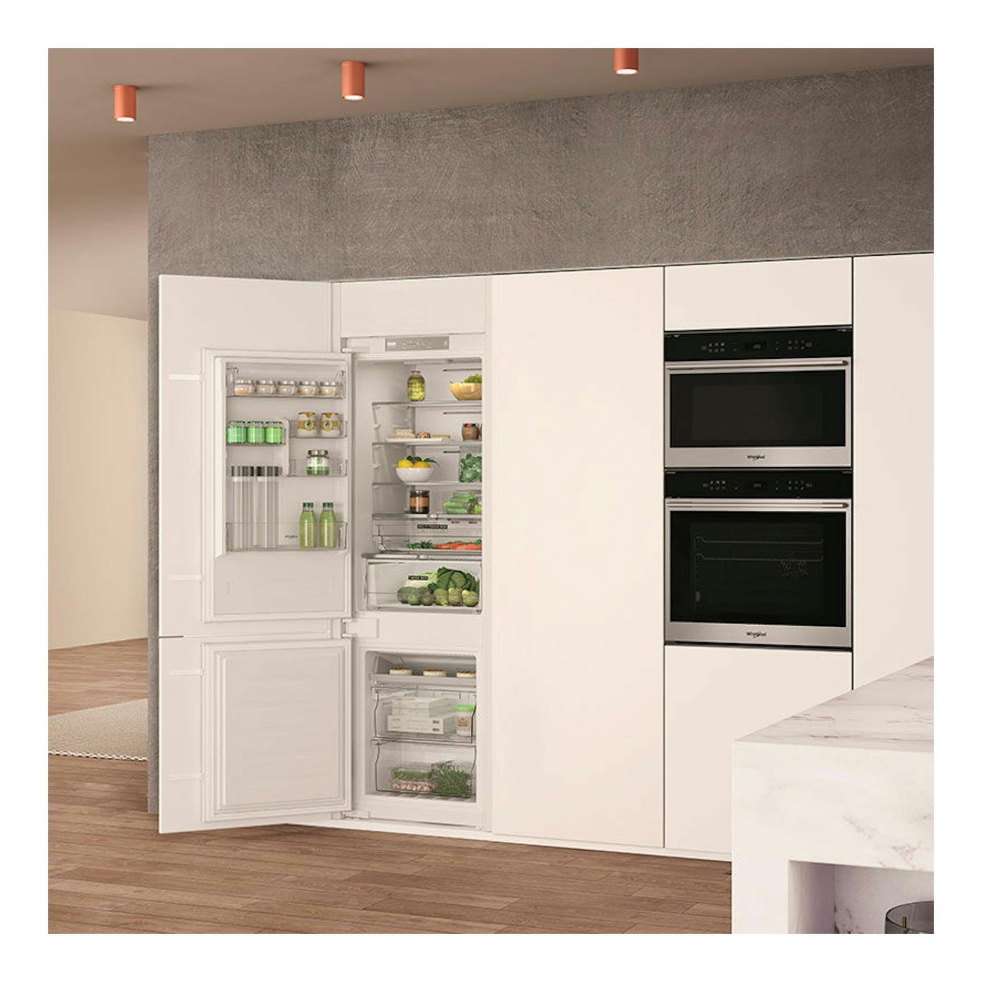 Frigorífico combi integrable Whirlpool WHC18 T323 en cocina, vista frontal con puertas abiertas, blanco.