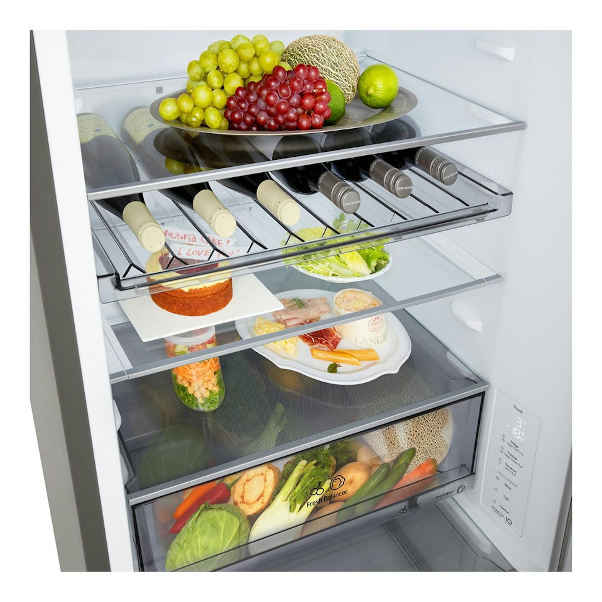 Vista frontal del interior de un frigorífico combi LG GBBS312BPY.APYQEUZ, con estantes de vidrio y alimentos.