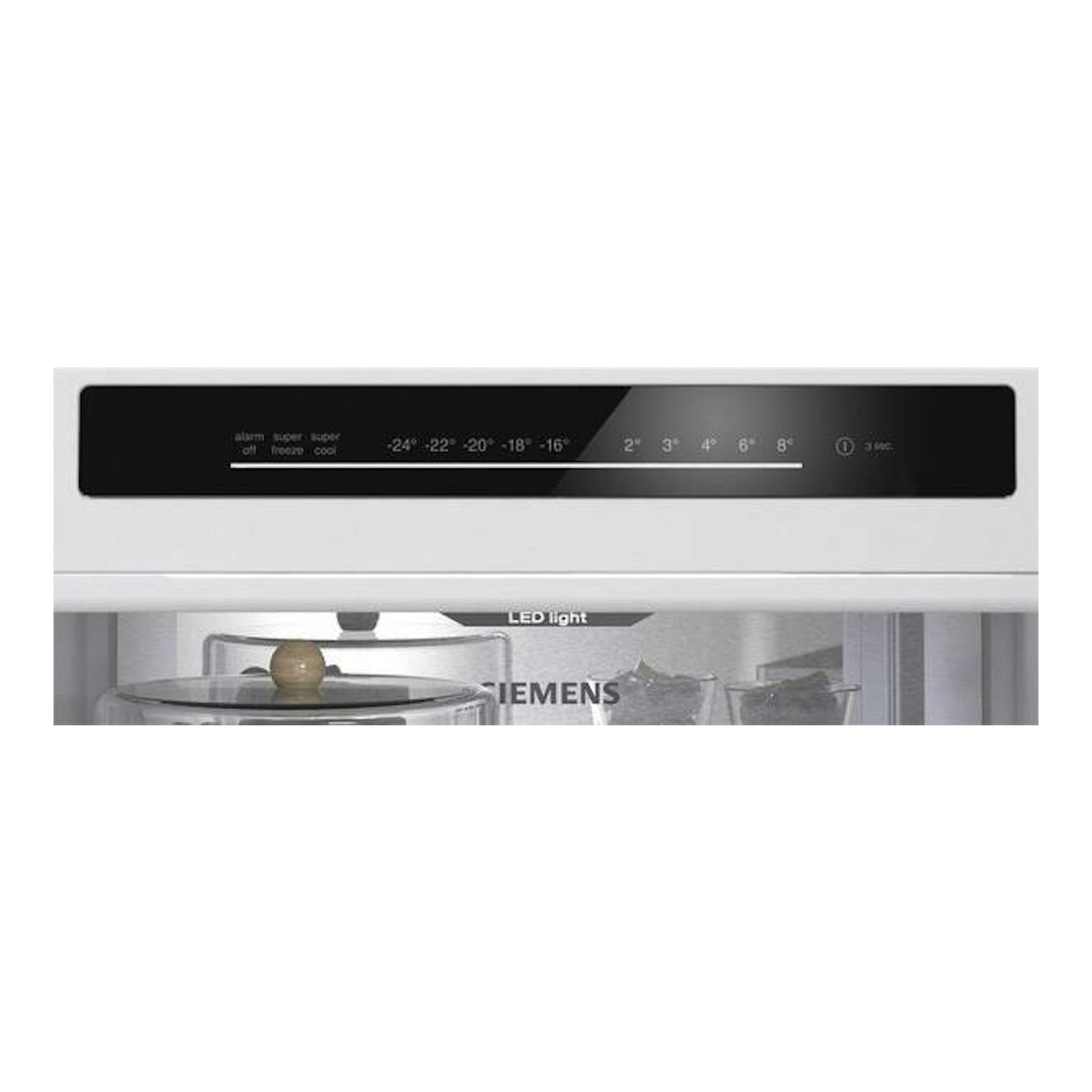 Frigorífico combi Siemens KG36NVWCG, vista frontal parcial del panel táctil negro y luz LED interior en blanco.
