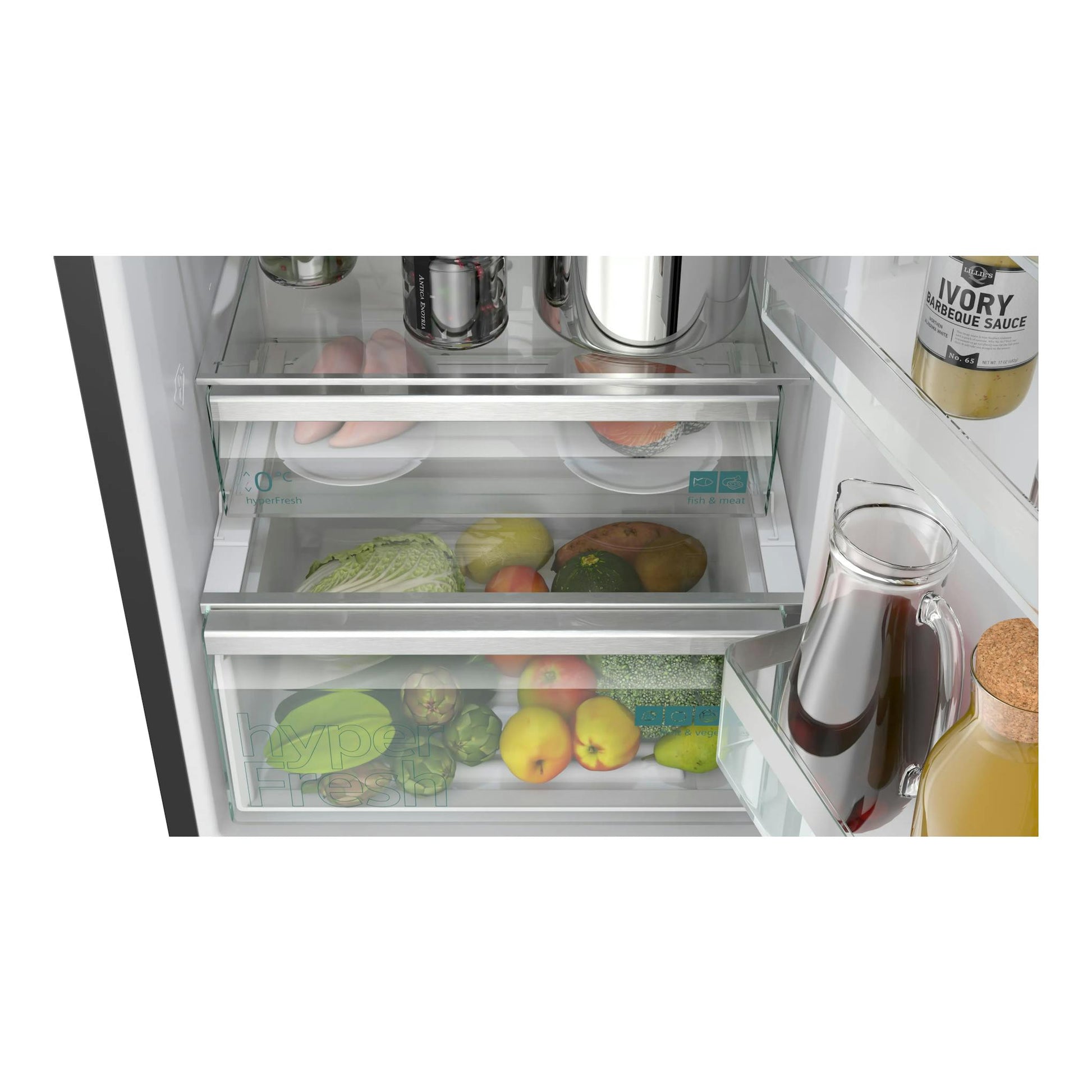 Interior de frigorífico Siemens KG39NVXCG con cajones transparentes y alimentos frescos, vista frontal.