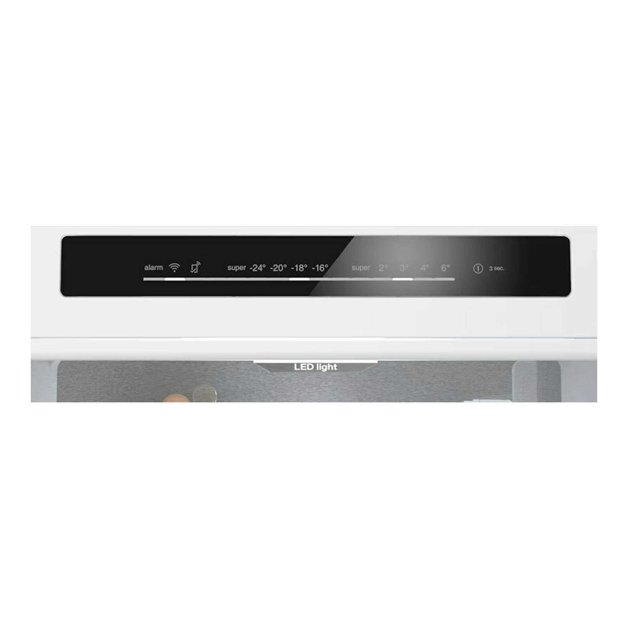 Siemens KG49NSBBF, panel de control negro en un frigorífico combi blanco, vista frontal parcial.