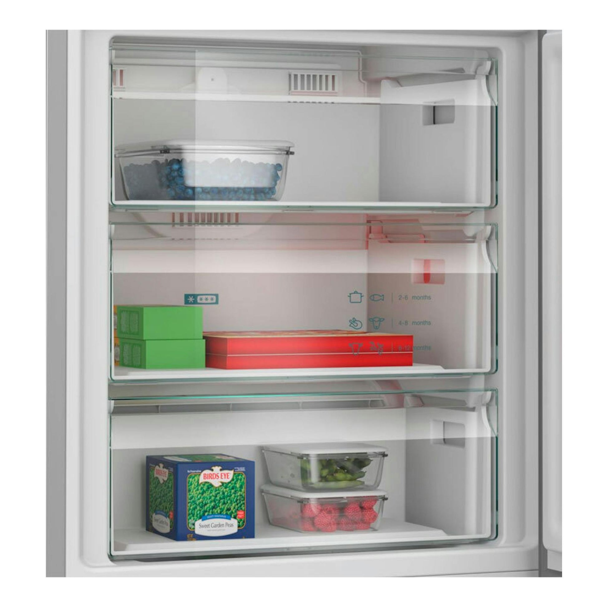 Frigorífico combi Siemens KG49NXIDF inox, con puerta abierta y cajones transparentes con alimentos.