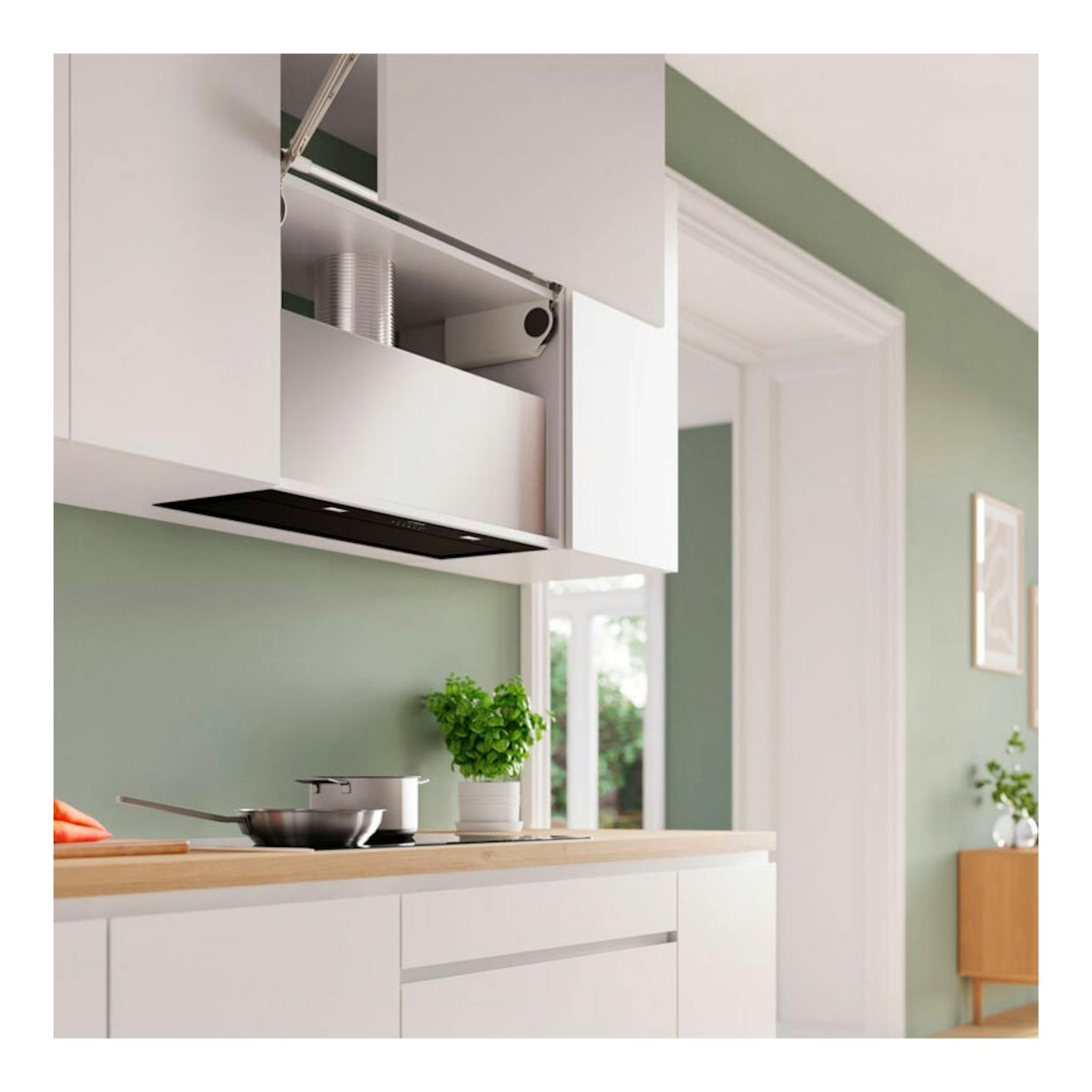 Grupo filtrante Bosch DLN88PC60 negro, vista frontal bajo mueble de cocina.