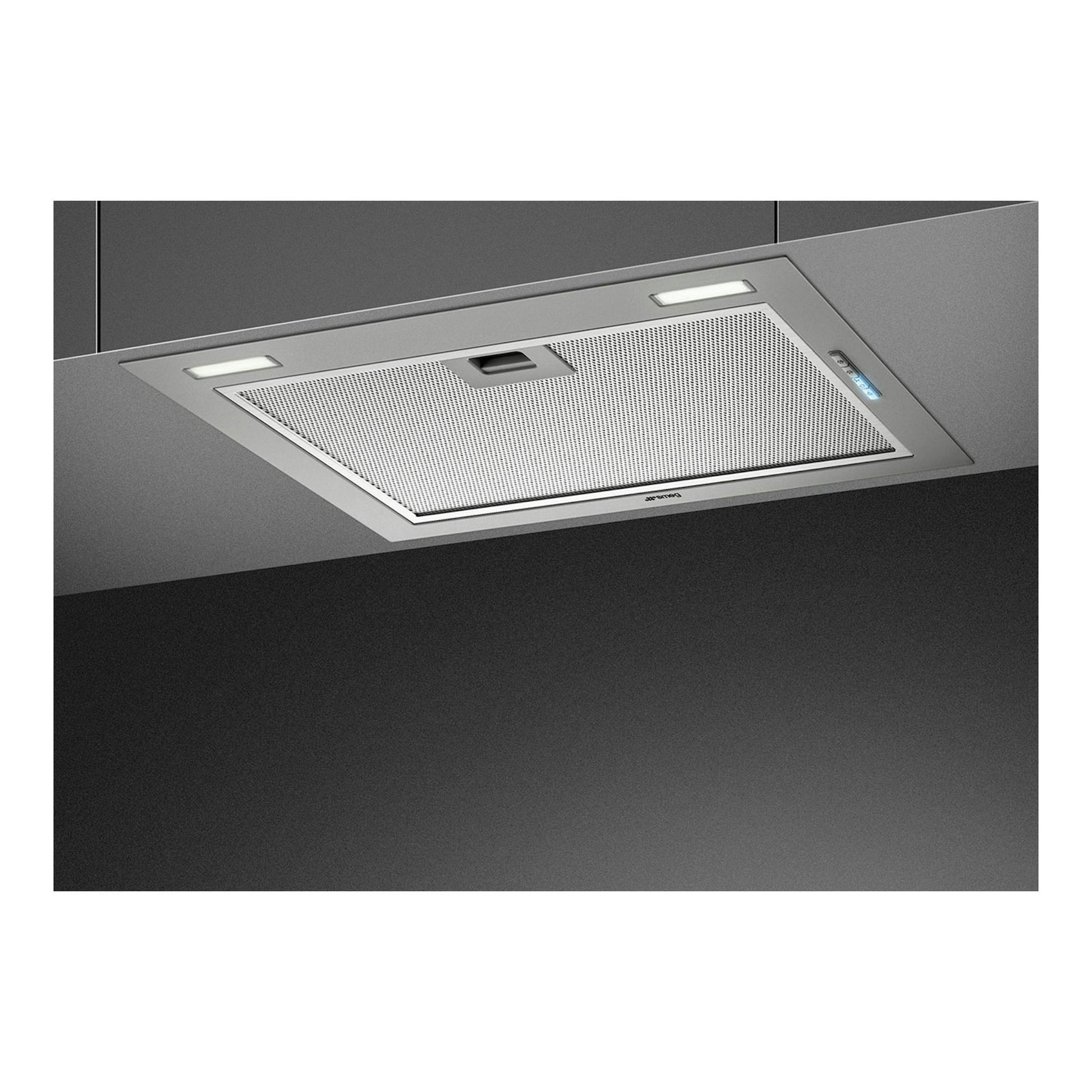 Grupo filtrante Smeg KSG52HPE en inox, vista inferior inclinada, con luces LED y filtro metálico.