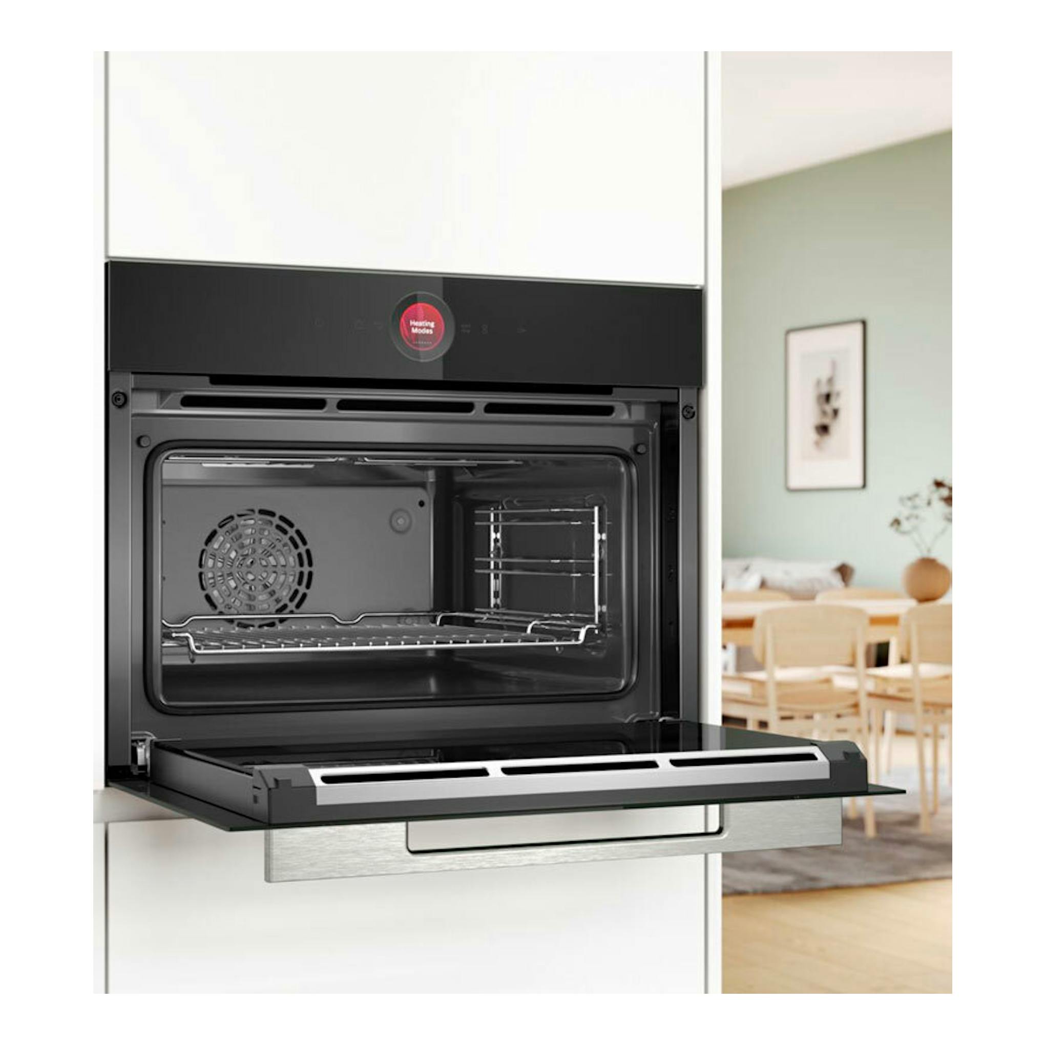 Horno Bosch CBG7341B1 negro empotrado, con la puerta abatible abierta y el interior visible.