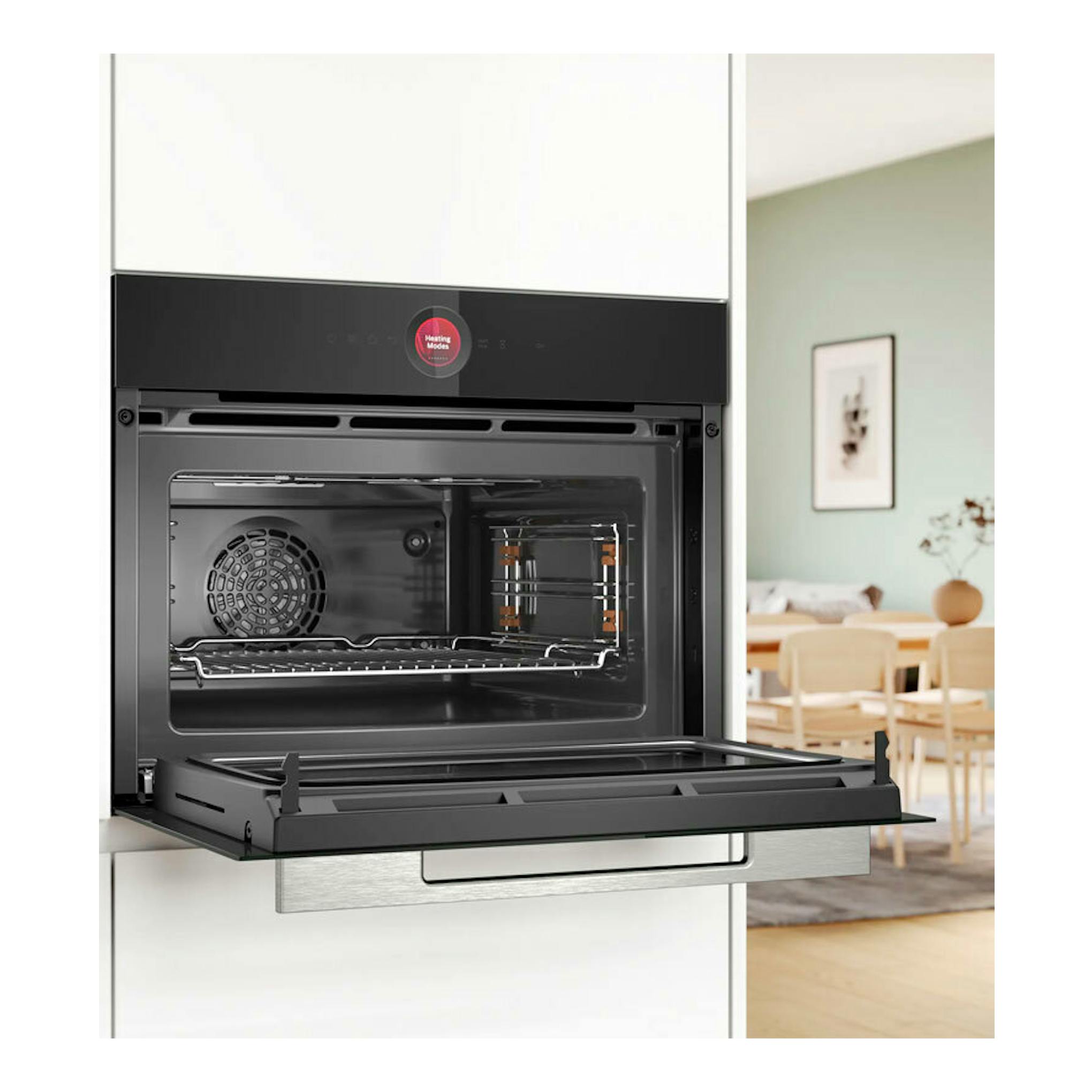 Bosch CMG7241B1, horno empotrable negro abierto, vista frontal con la puerta abatida y el interior visible.