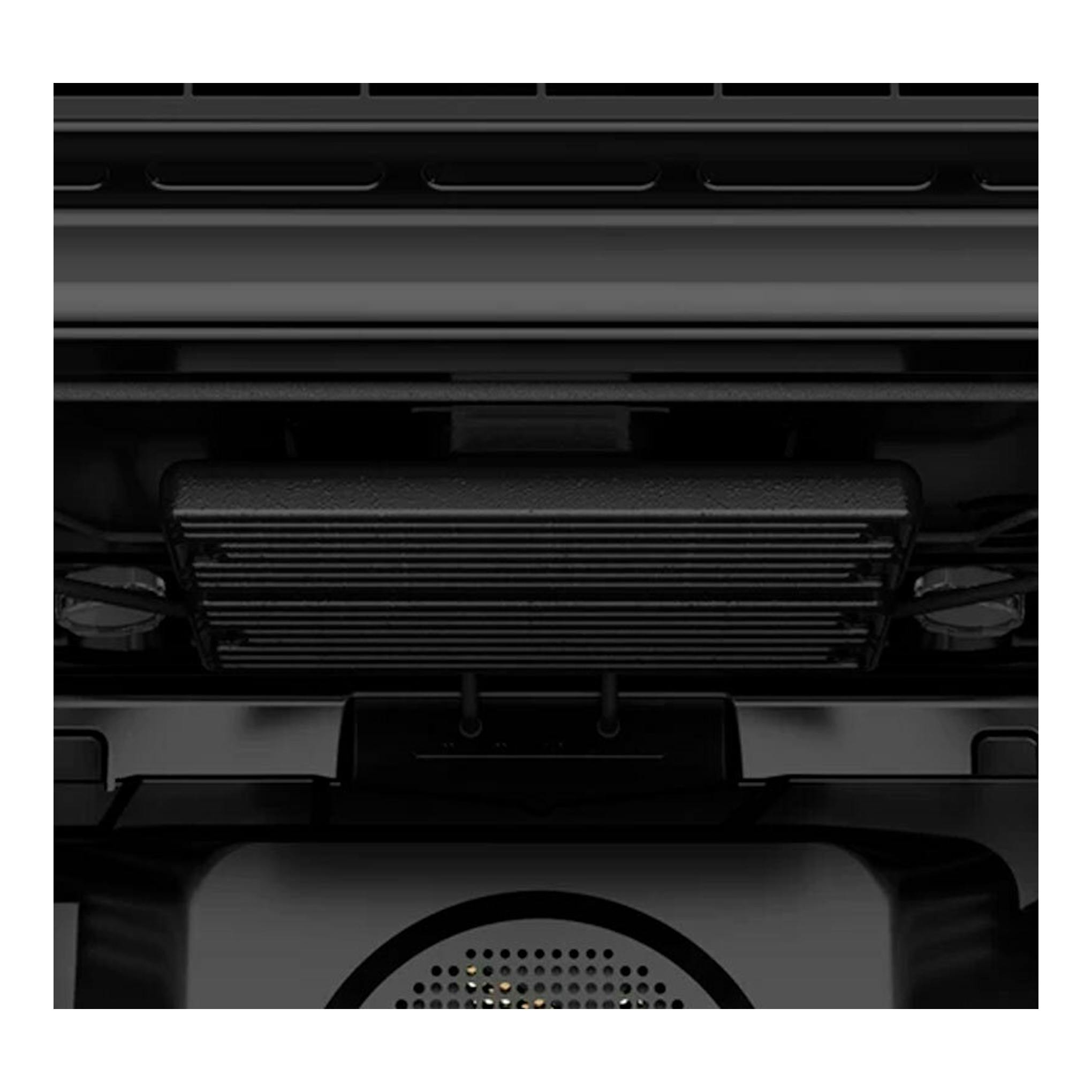 Horno integrable STEAKMASTER de cristal negro, vista frontal en primer plano del interior con parrilla.