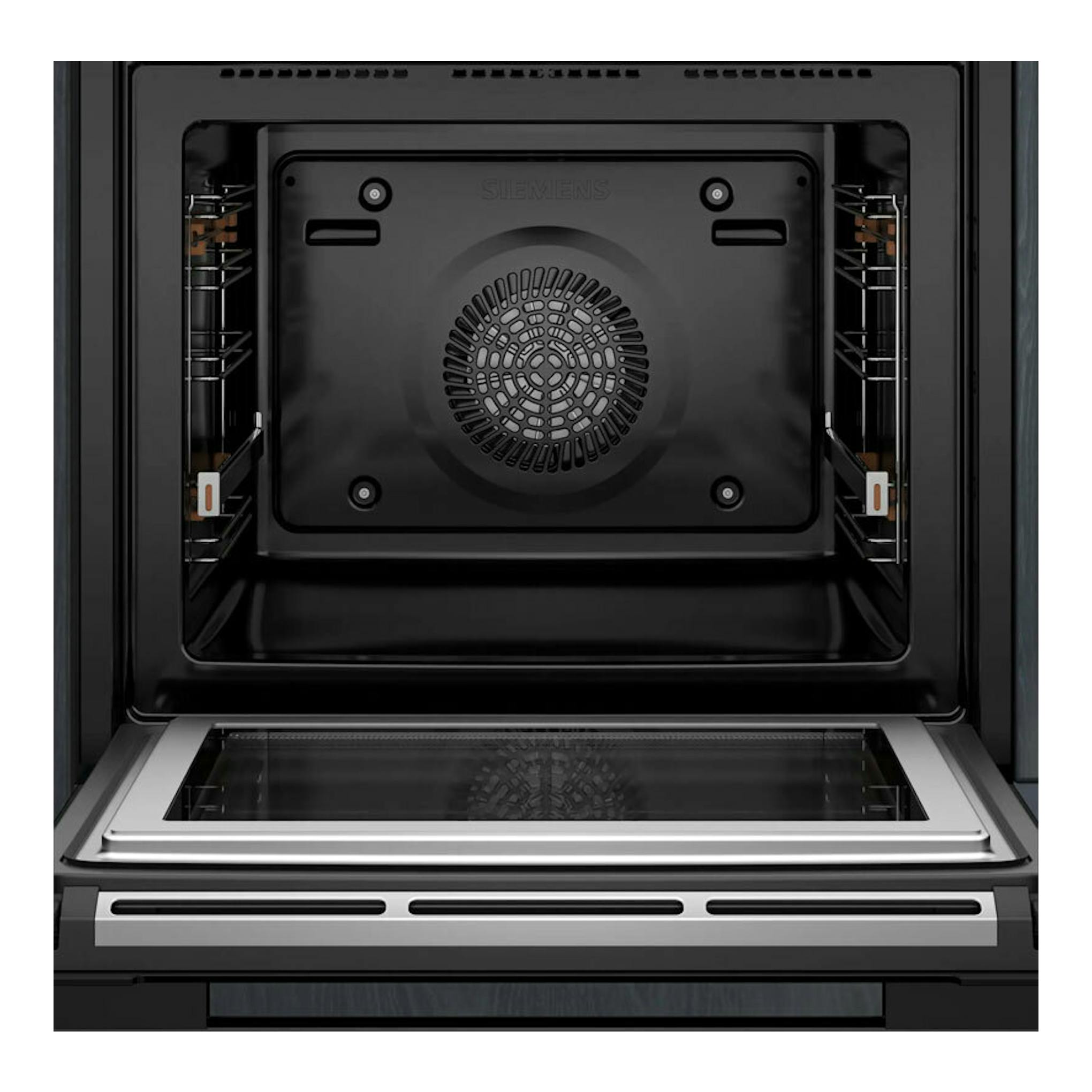 Interior de horno Siemens HM776GKB1 negro, vista frontal con la puerta abatible abierta.
