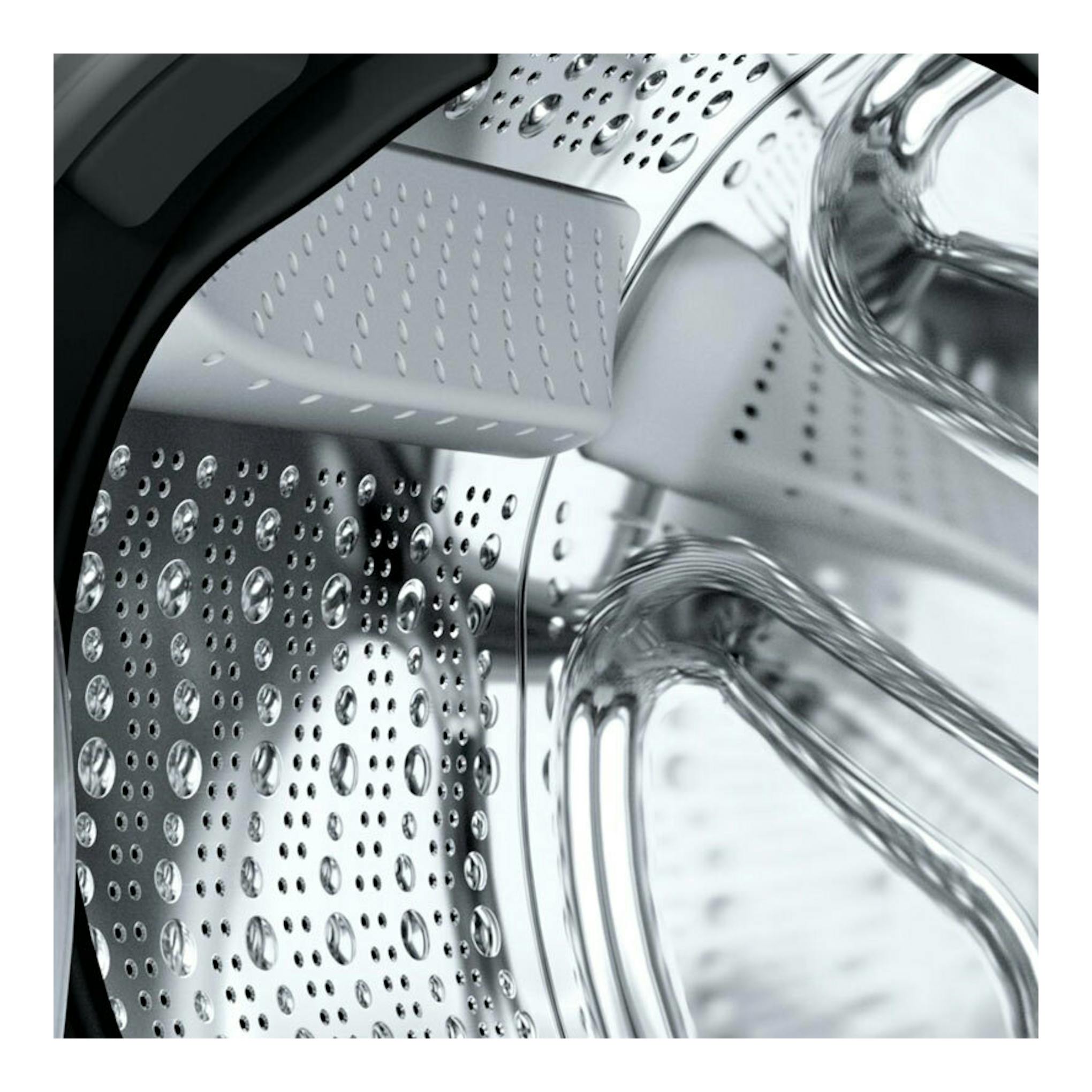 Balay 3TS3104BH: primer plano del tambor de acero inoxidable de una lavadora, con perforaciones y aspas internas.