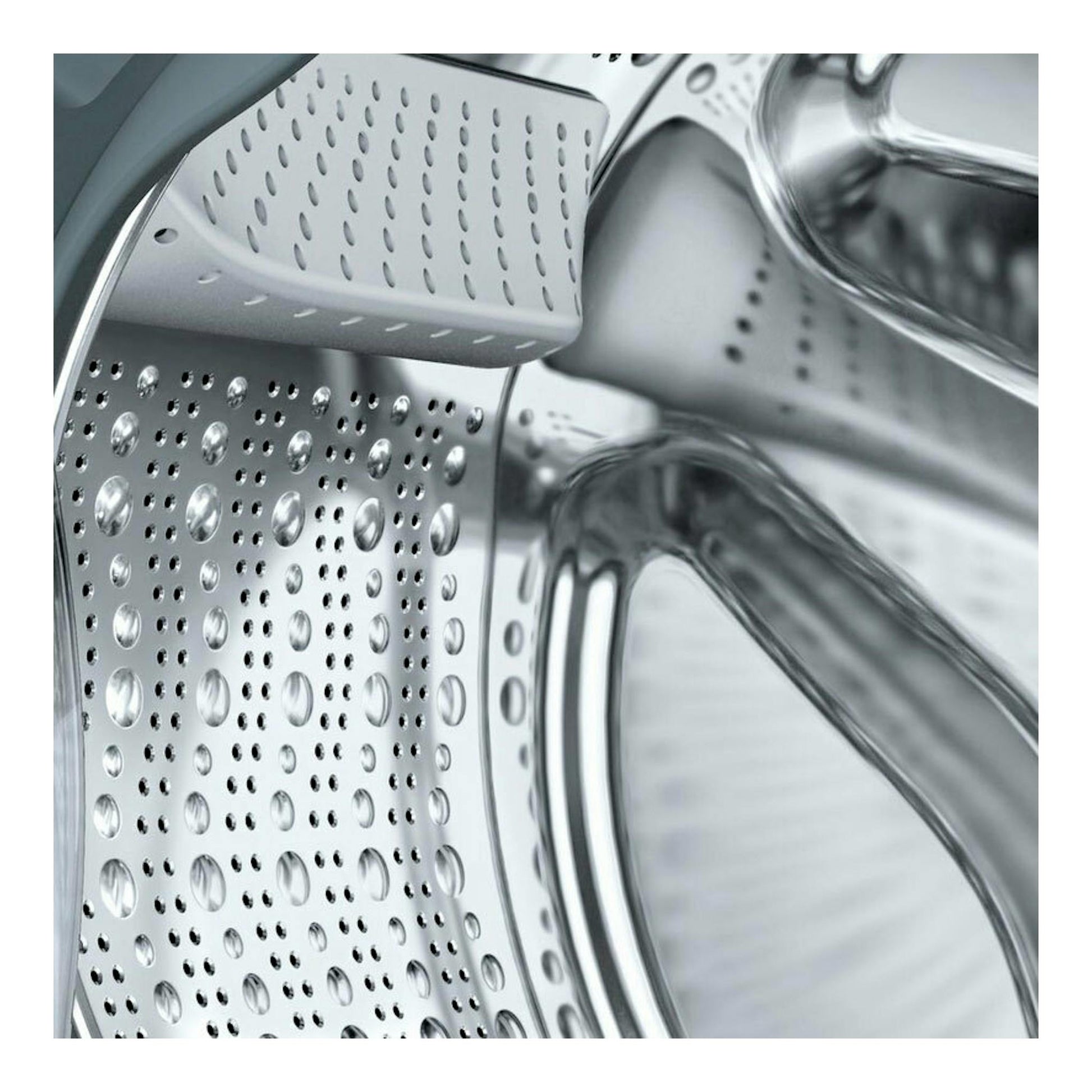 Lavadora integrable Siemens WI12W326ES, primer plano del tambor de acero inoxidable, vista frontal.