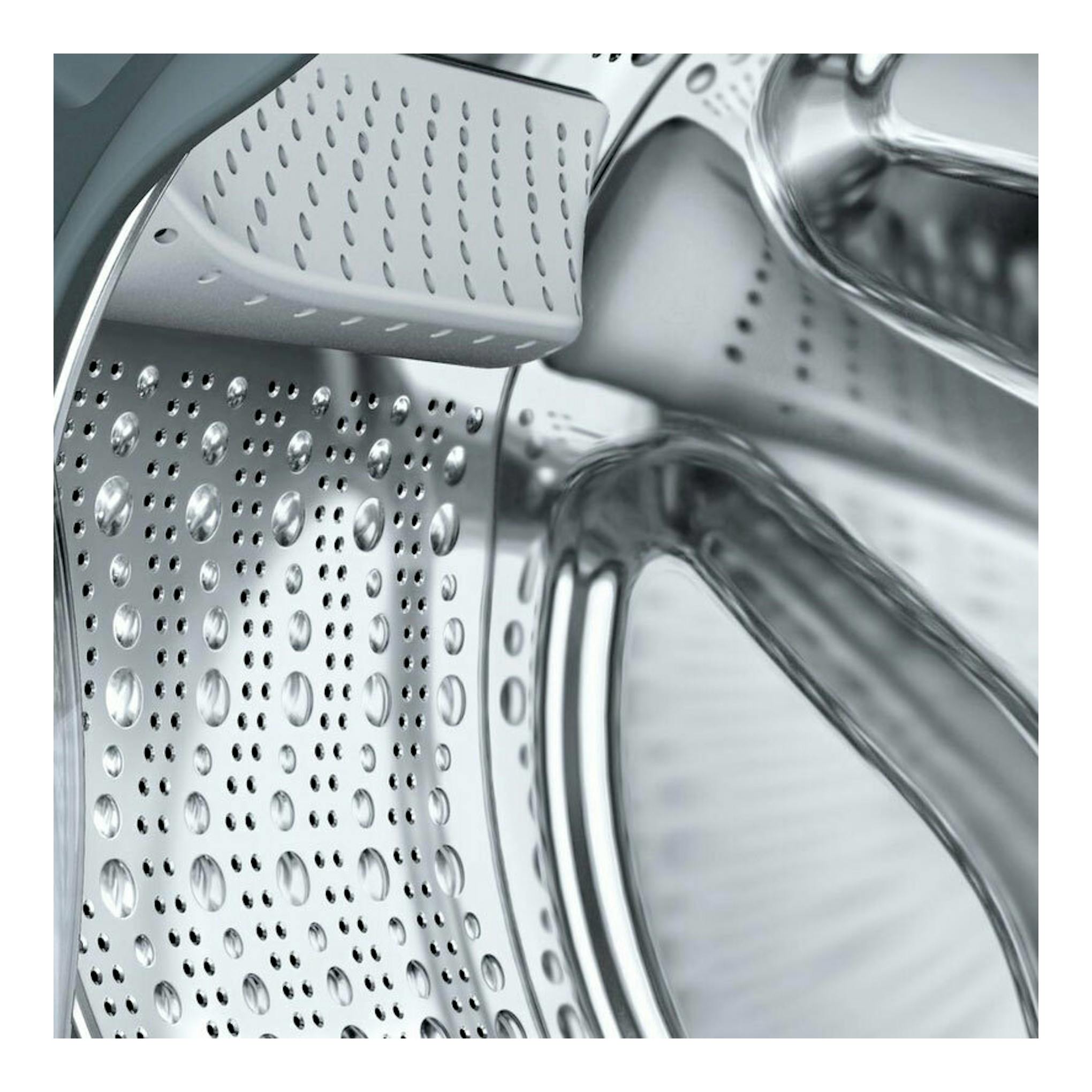 Lavadora integrable Siemens WI12W326ES, primer plano del tambor de acero inoxidable, vista frontal.