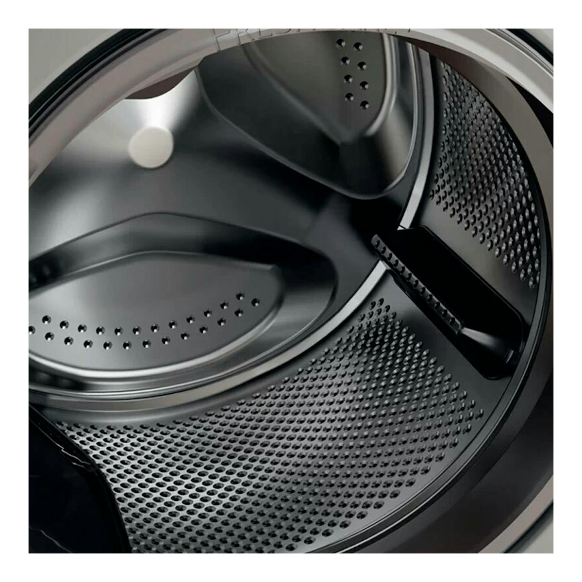 Lavadora Whirlpool FFB8489SBVSPT, vista interior del tambor metálico gris, en primer plano.