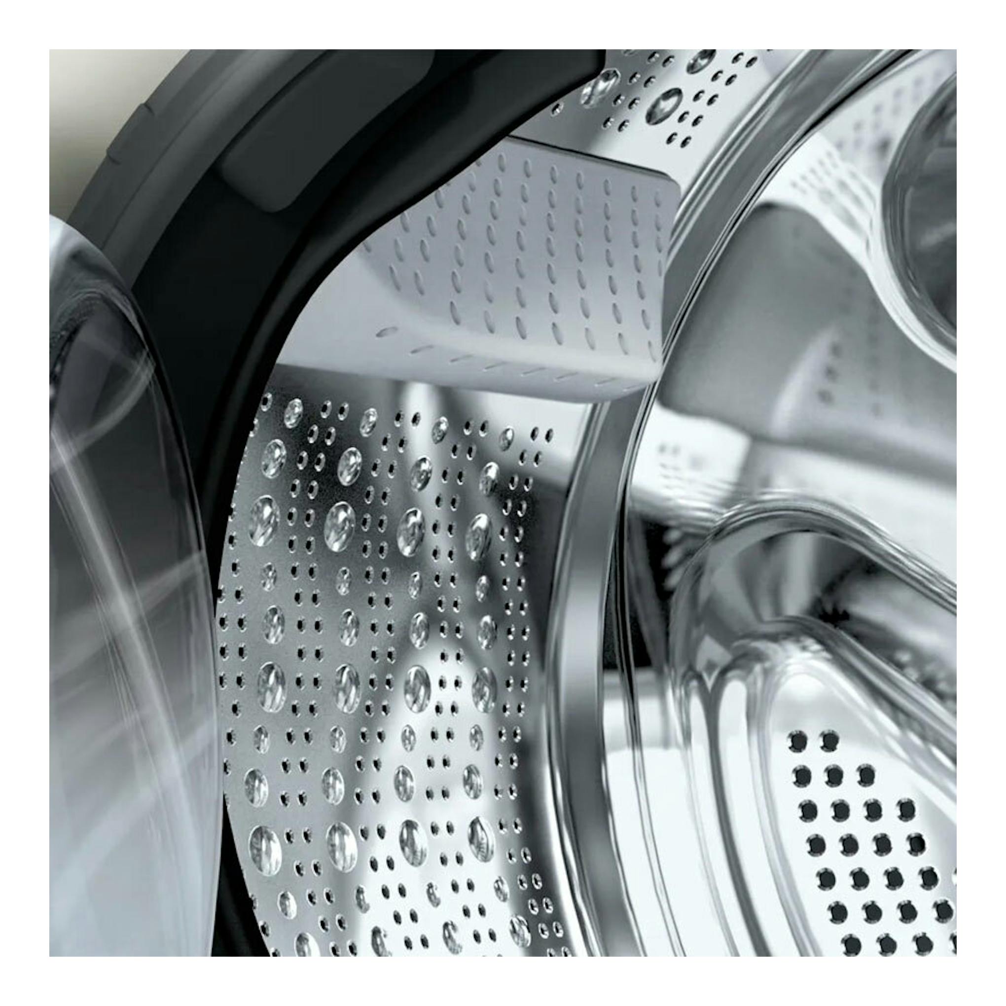 Interior del tambor de una lavasecadora Bosch WNA1341XES en acero inoxidable, vista frontal.