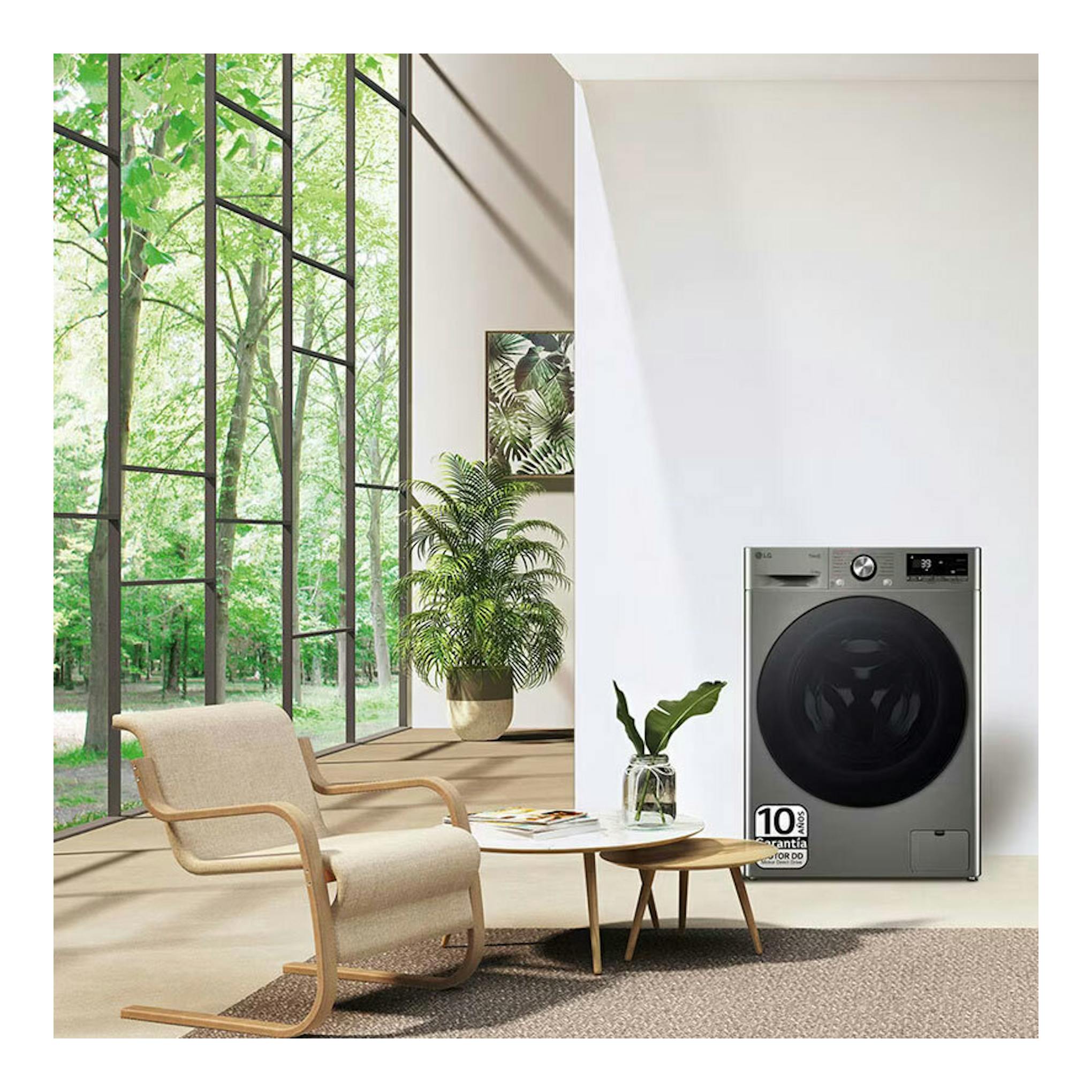 Lavasecadora LG F4DR7011AGS inox, vista frontal, junto a una pared blanca en una estancia luminosa.