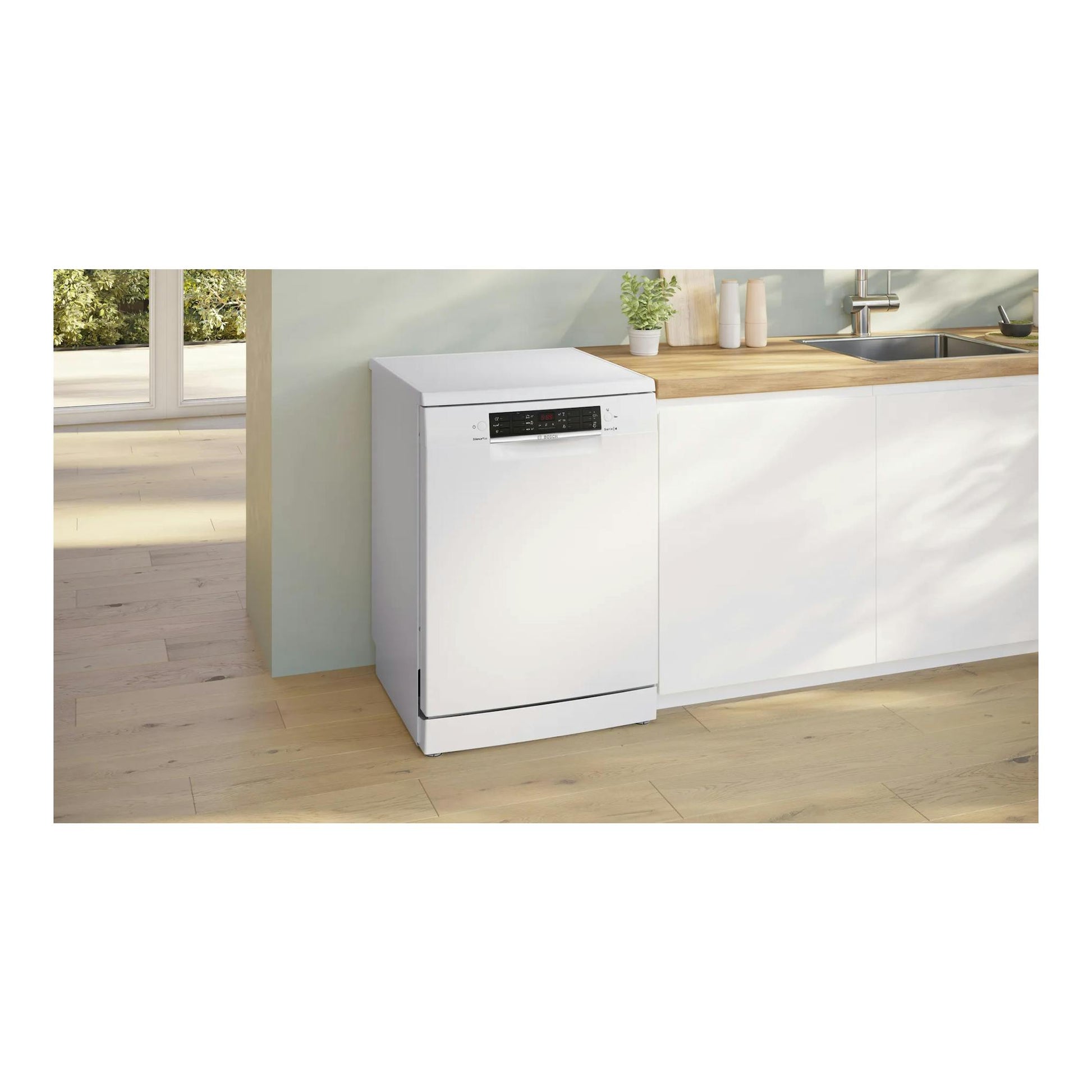 Lavavajillas Bosch SMS46KW02E blanco, vista frontal, en cocina con encimera de madera.