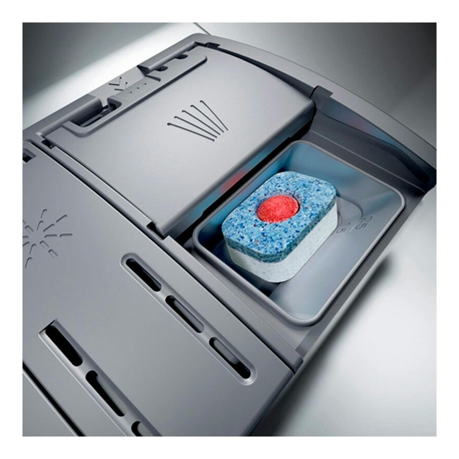 Lavavajillas Siemens SN23HW00KE en vista cenital, compartimento de detergente gris con pastilla.