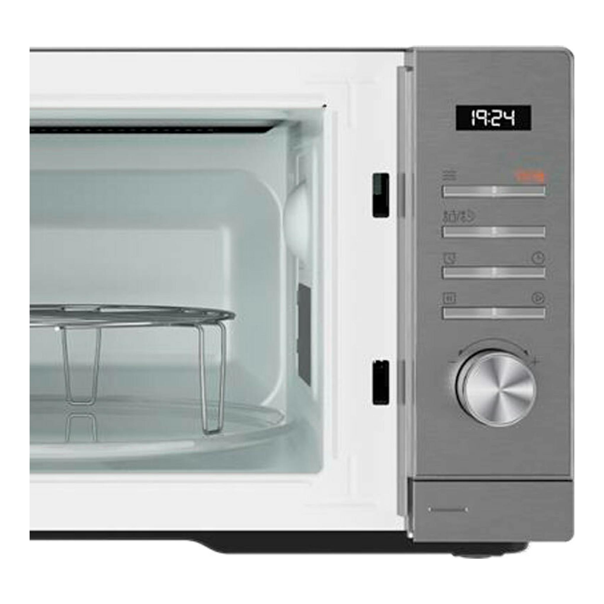 Microondas Teka MWEFS25G inox, vista frontal abierta, panel gris con reloj digital y mando giratorio.