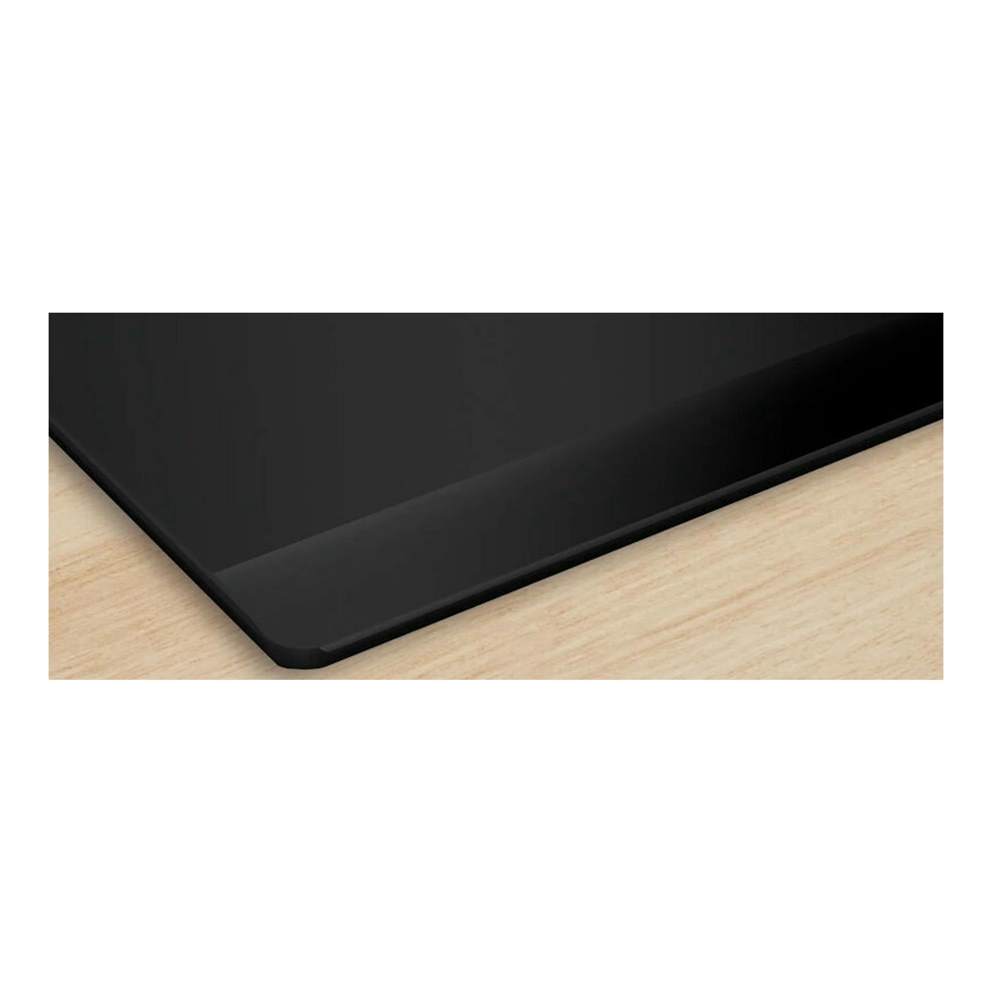 Placa de inducción Bosch PVS631HC1E negra, vista en ángulo sobre encimera de madera.