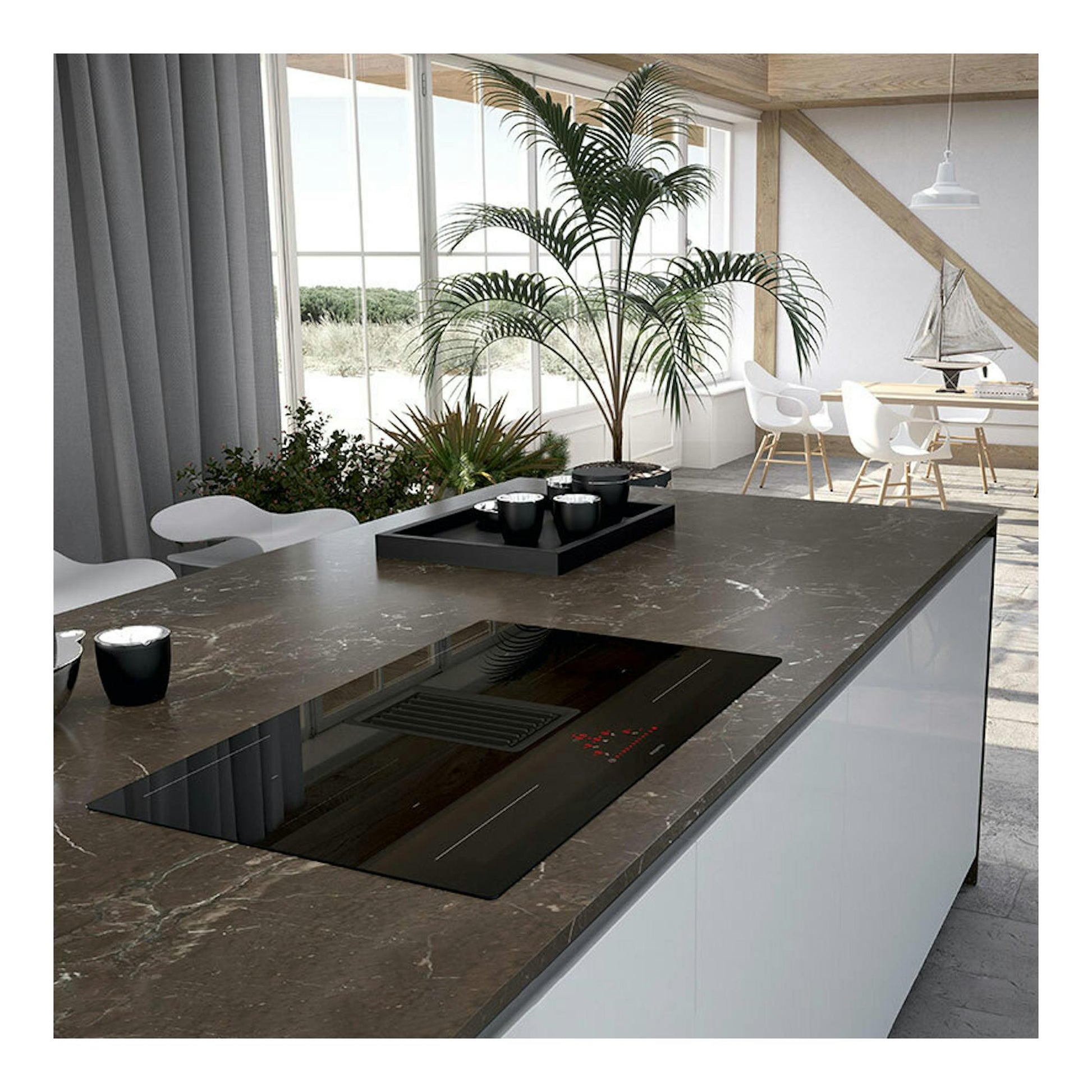 Placa de inducción Mepamsa Indu Pro negra con extractor integrado, vista en isla de cocina.