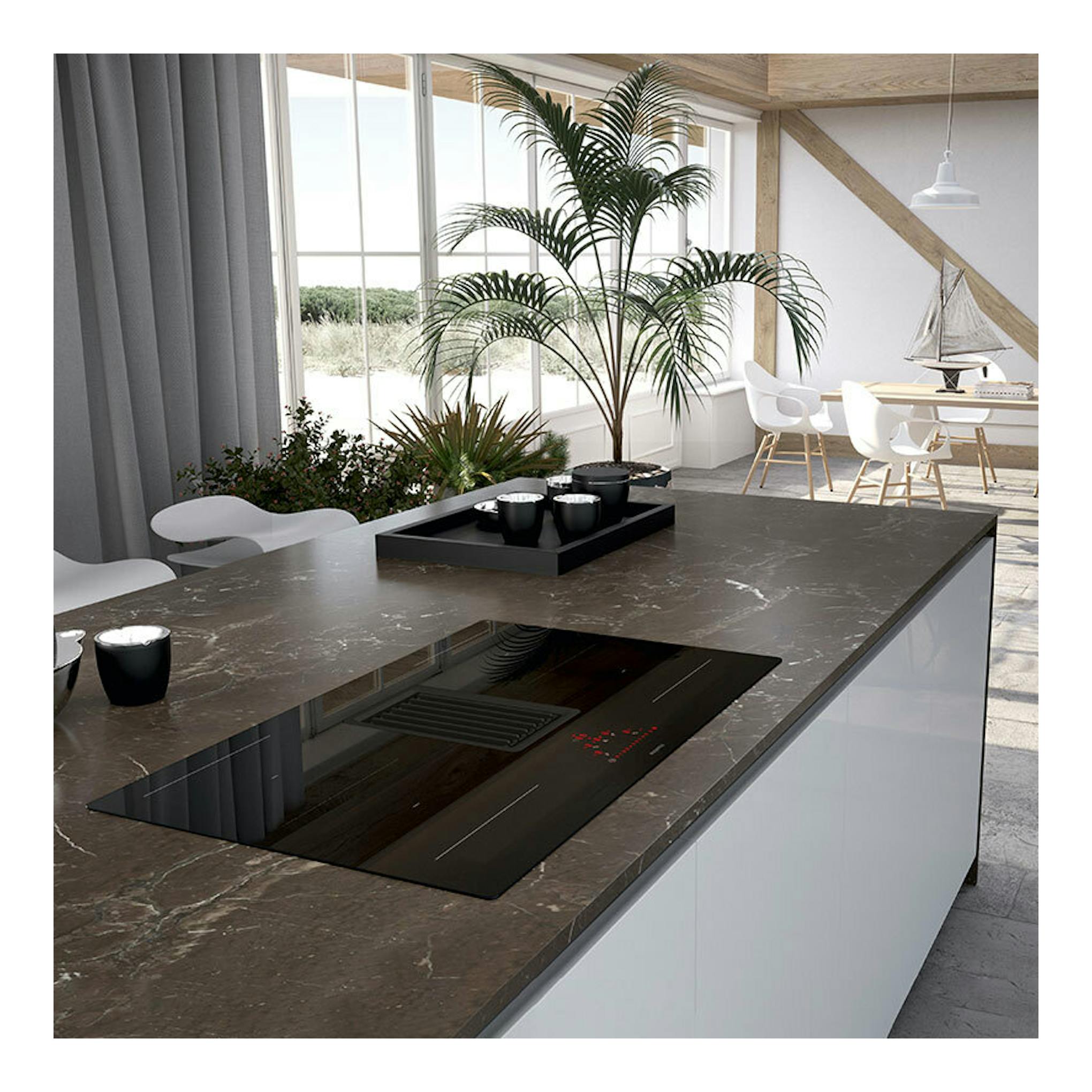 Placa de inducción Mepamsa Indu Pro negra con extractor integrado, vista en isla de cocina.