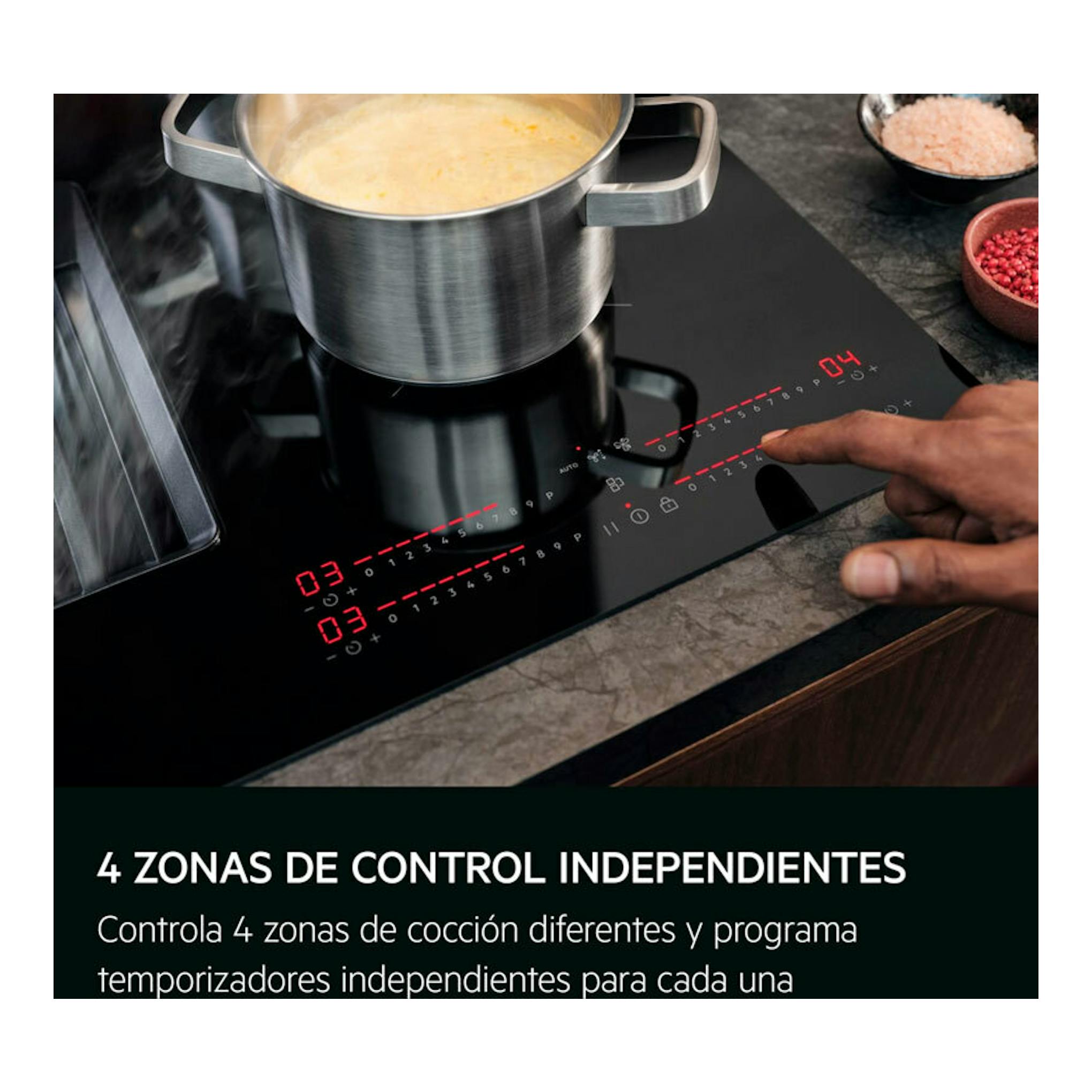 Vista superior inclinada de placa de inducción AEG TH84CB03FB negra con olla, controles táctiles y extractor integrado.