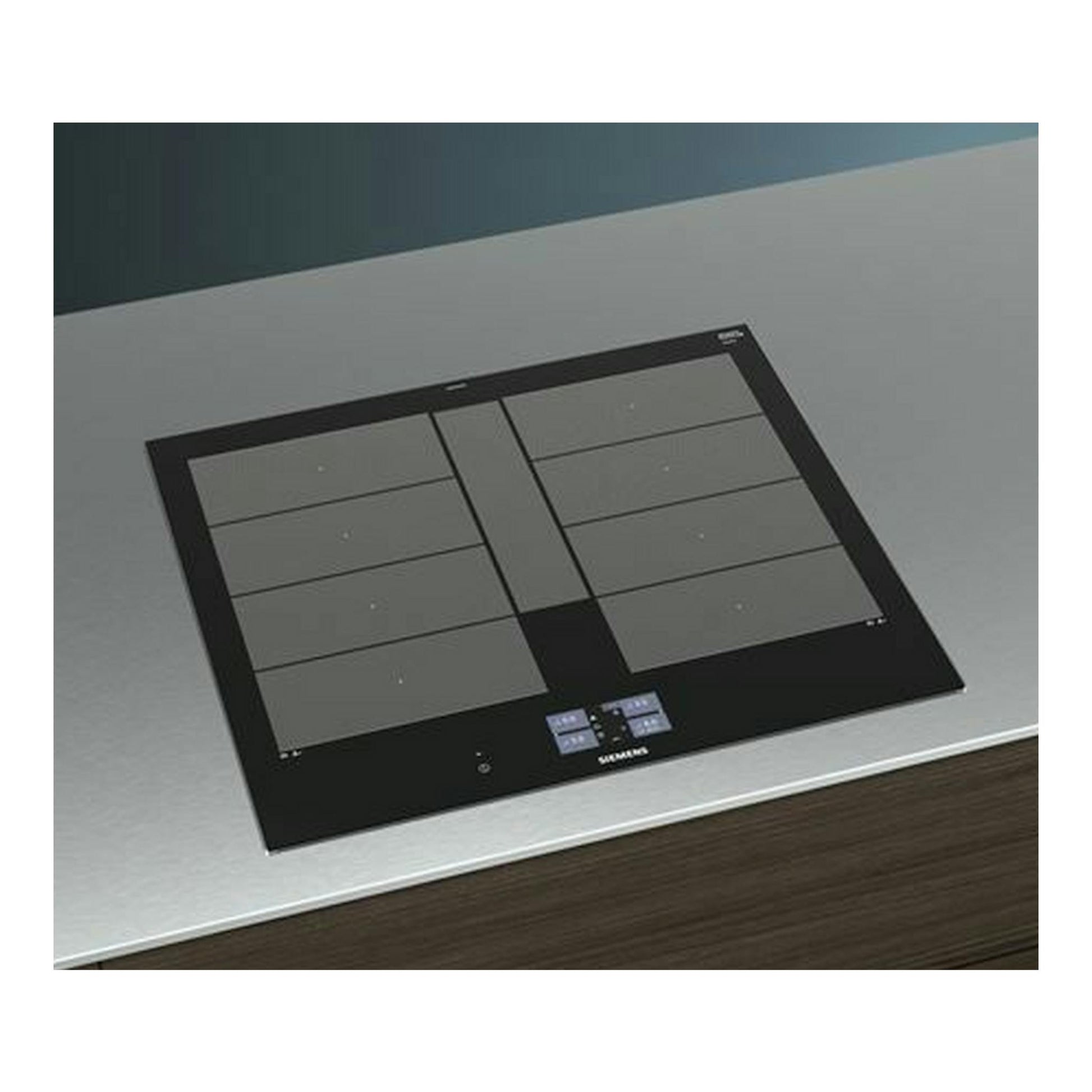 Placa de inducción Siemens EX675JYW1E negra, vista cenital inclinada, empotrada en encimera gris.