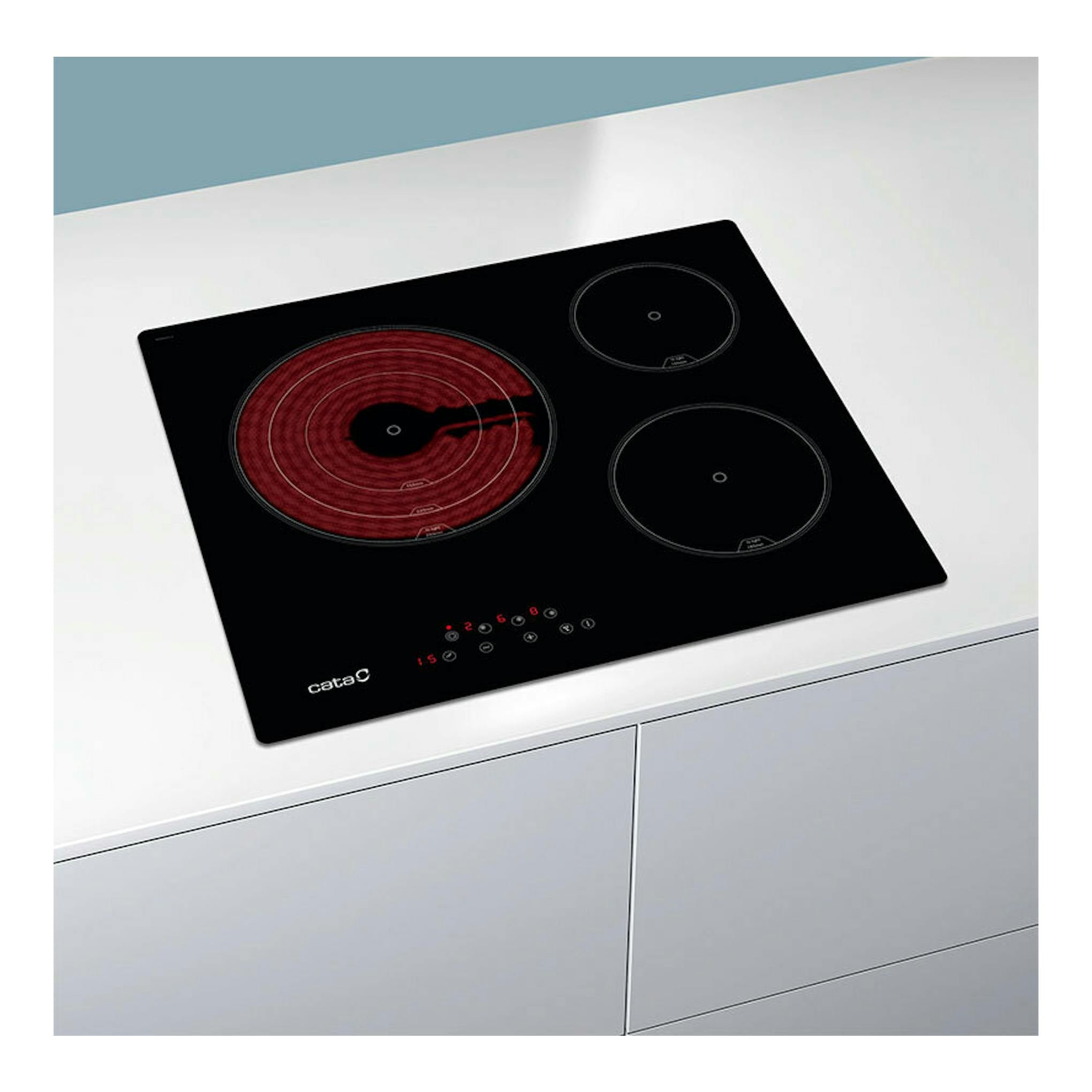 Placa vitrocerámica Cata TT6003 e-tech negra, vista en ángulo, con tres zonas de cocción y mandos táctiles.