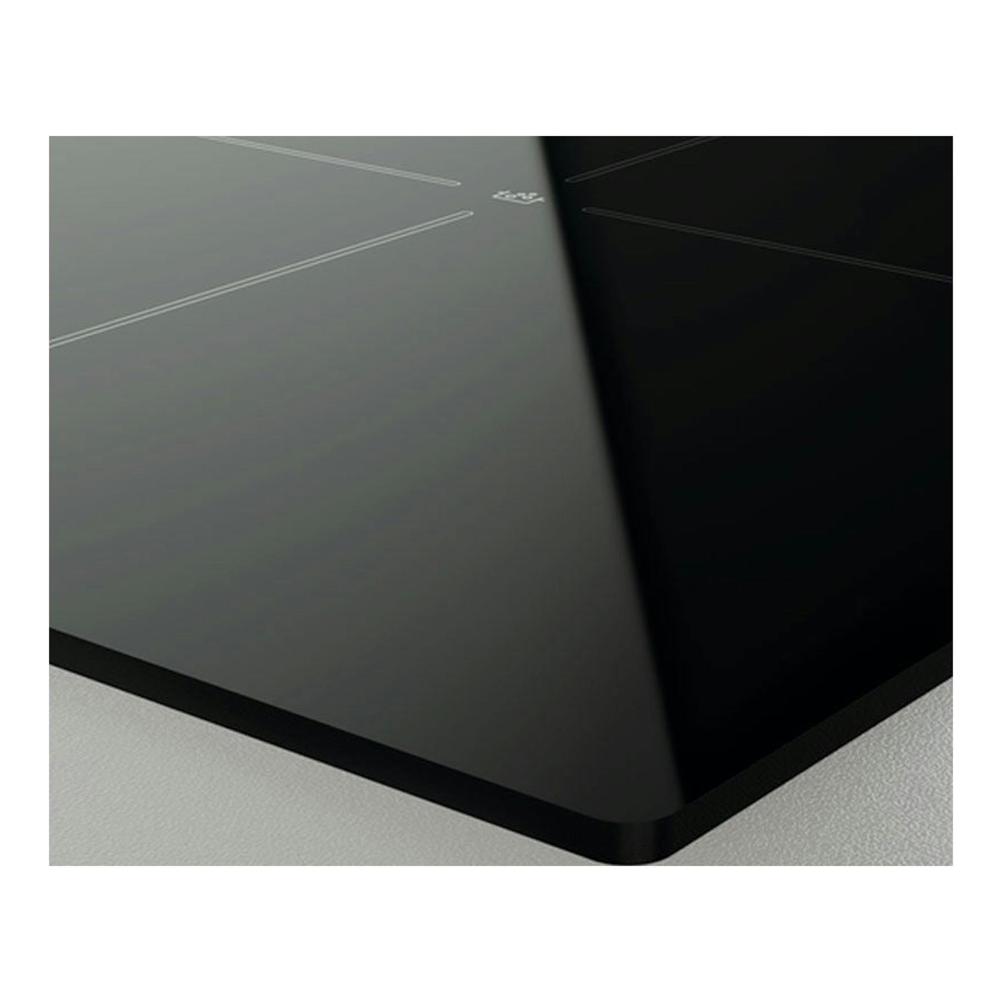 Placa vitrocerámica Zanussi ZHRN639K negra, vista en ángulo de una esquina de vidrio negro.