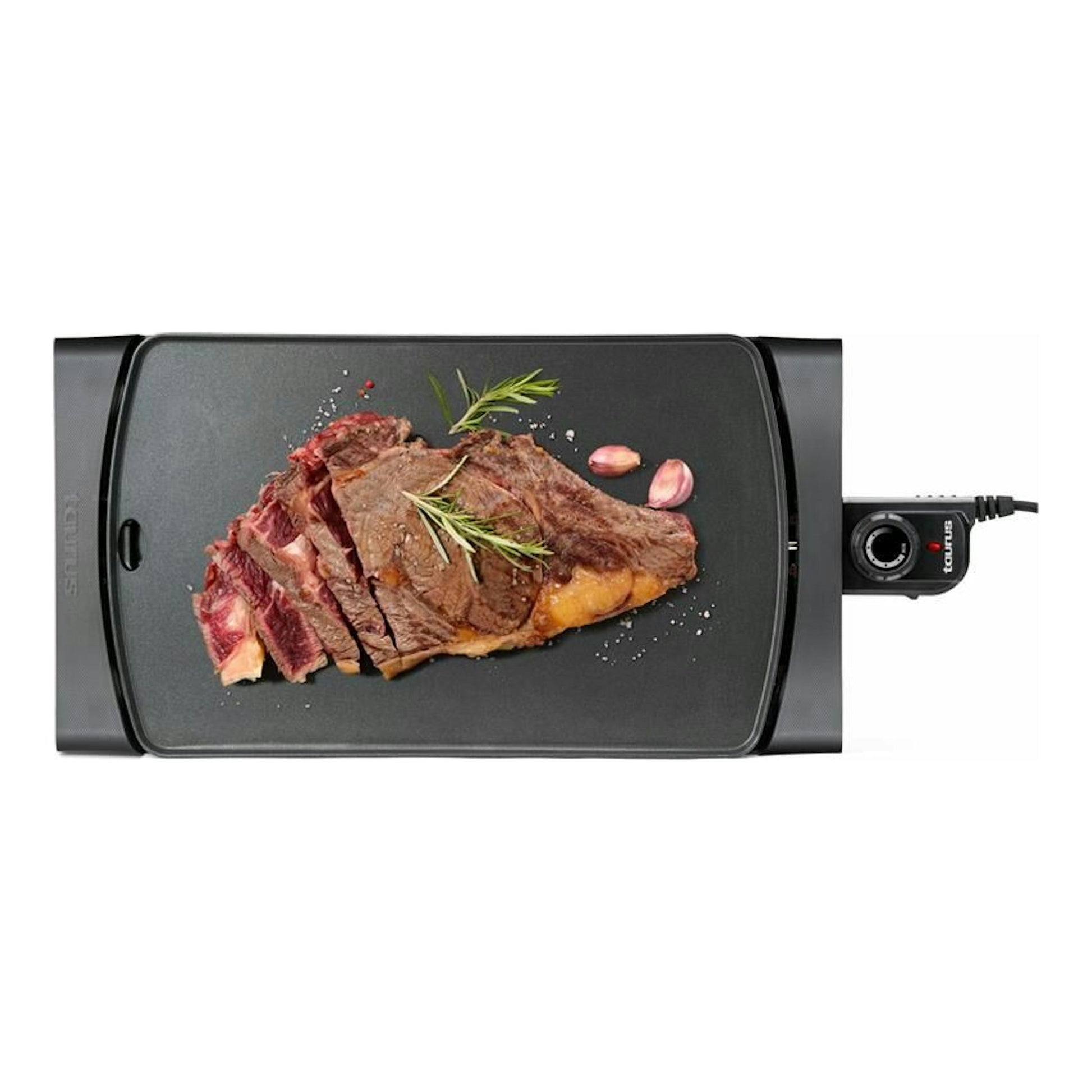 Plancha asar Taurus Steakmax 2600 negra, vista superior, con filete y control de temperatura a la derecha.