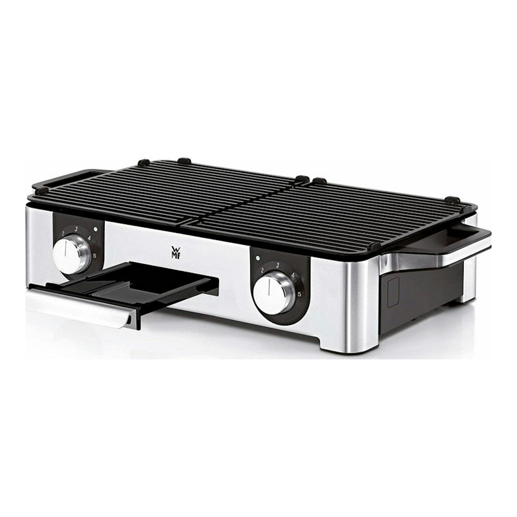 Plancha grill eléctrica WMF Master Grill LONO, negra y acero inoxidable, vista frontal en tres cuartos.