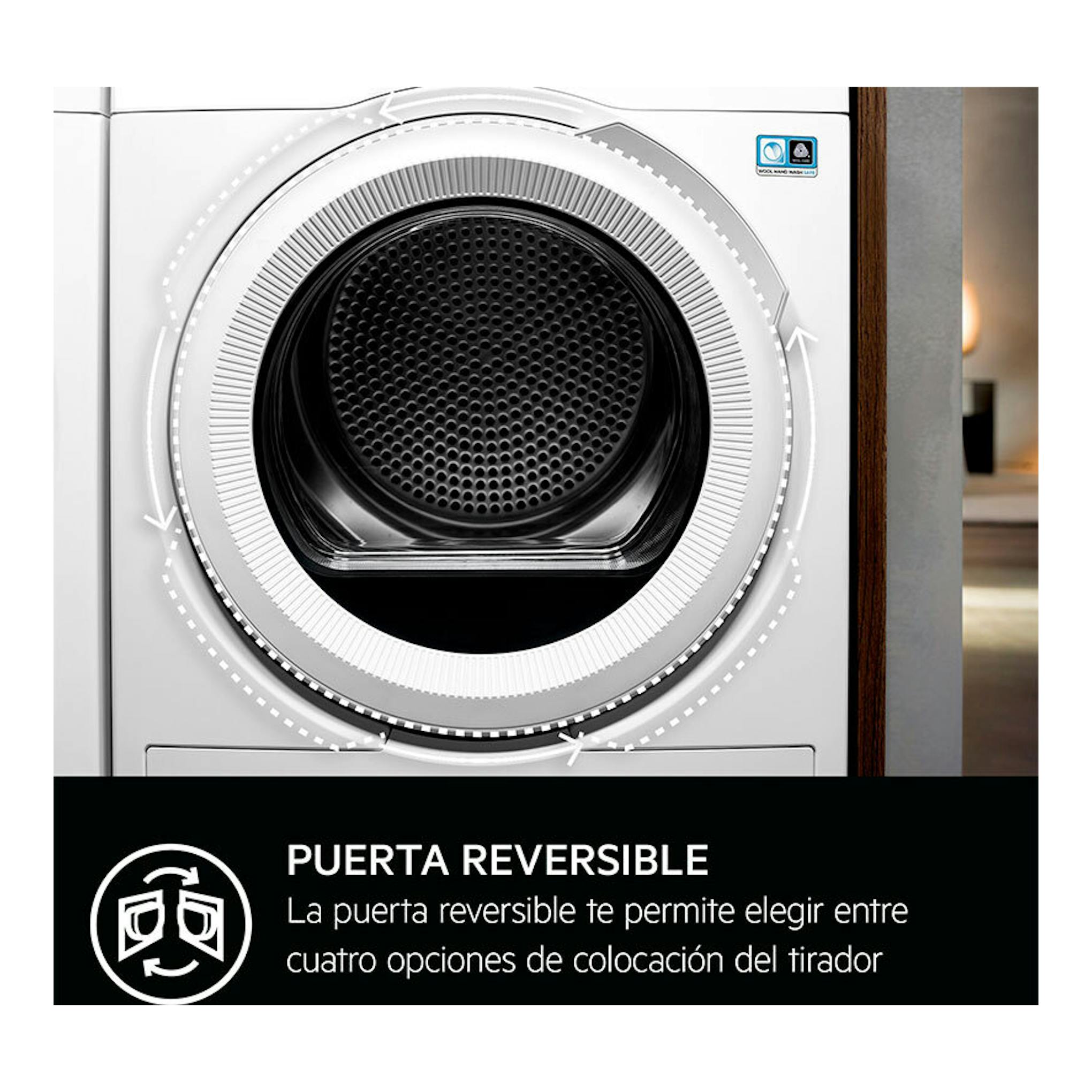 Secadora AEG TR718EAOB blanca, vista frontal de la puerta circular reversible con tambor negro.
