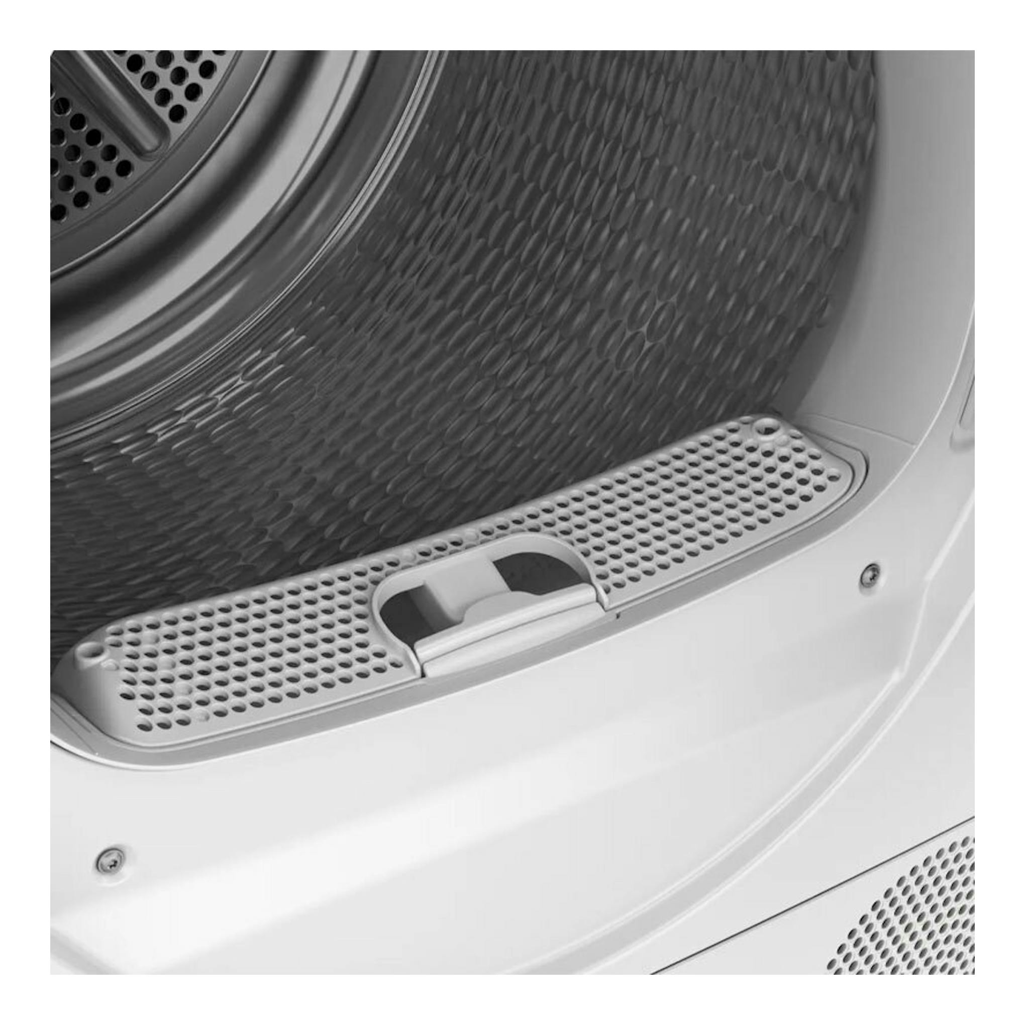 Bosch WTR83200ES: primer plano del interior de una secadora blanca, con tambor metálico perforado y filtro frontal.