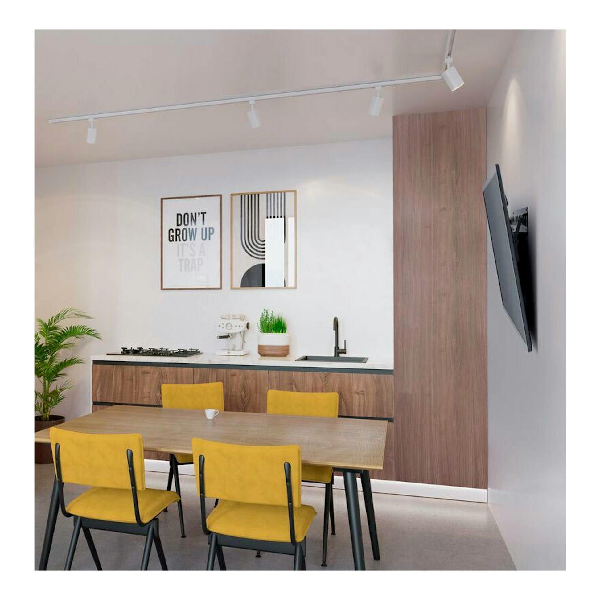 Soporte TV Vogels MA4010 negro, vista lateral montado en pared en una cocina moderna.