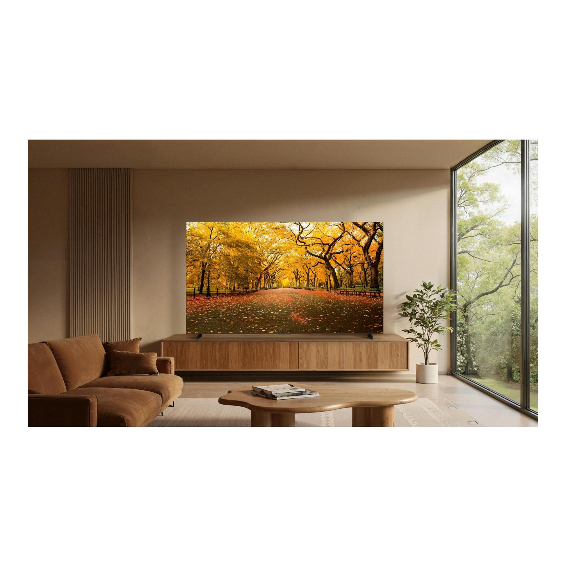 Televisor TCL 98C8L, vista frontal, sobre mueble de madera en salón, con escena de parque otoñal en pantalla.