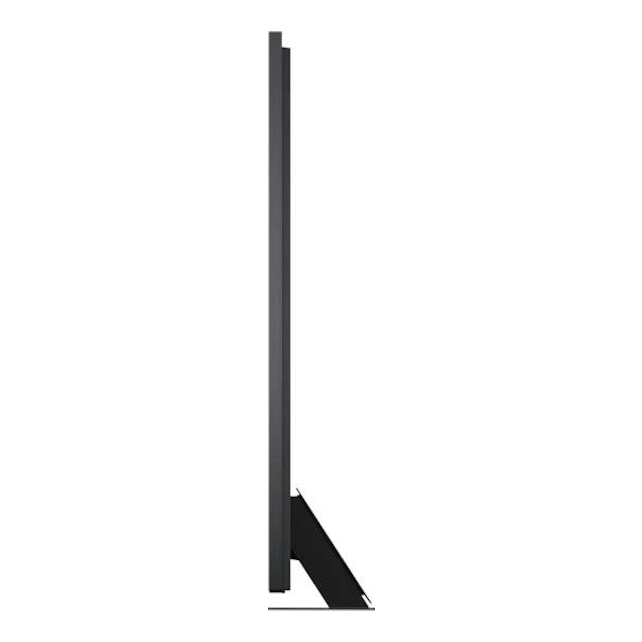 Televisor LG 100QNED87B6.AEU negro, vista lateral, sobre soporte inclinado.