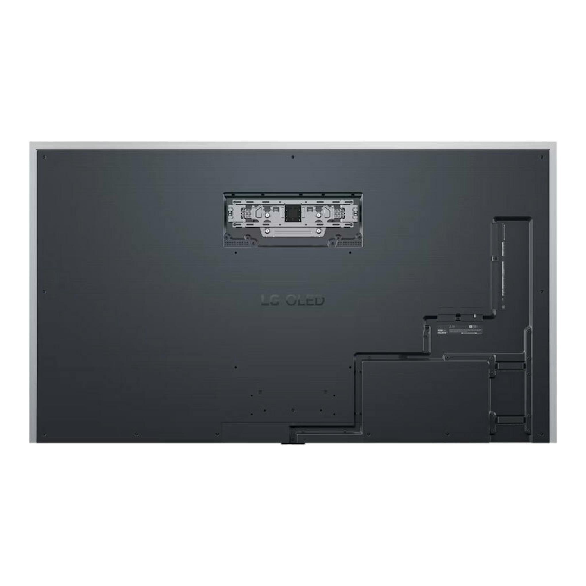 Vista trasera del TV LG OLED83G54LW negro, con soporte de pared y paneles de conexión visibles.