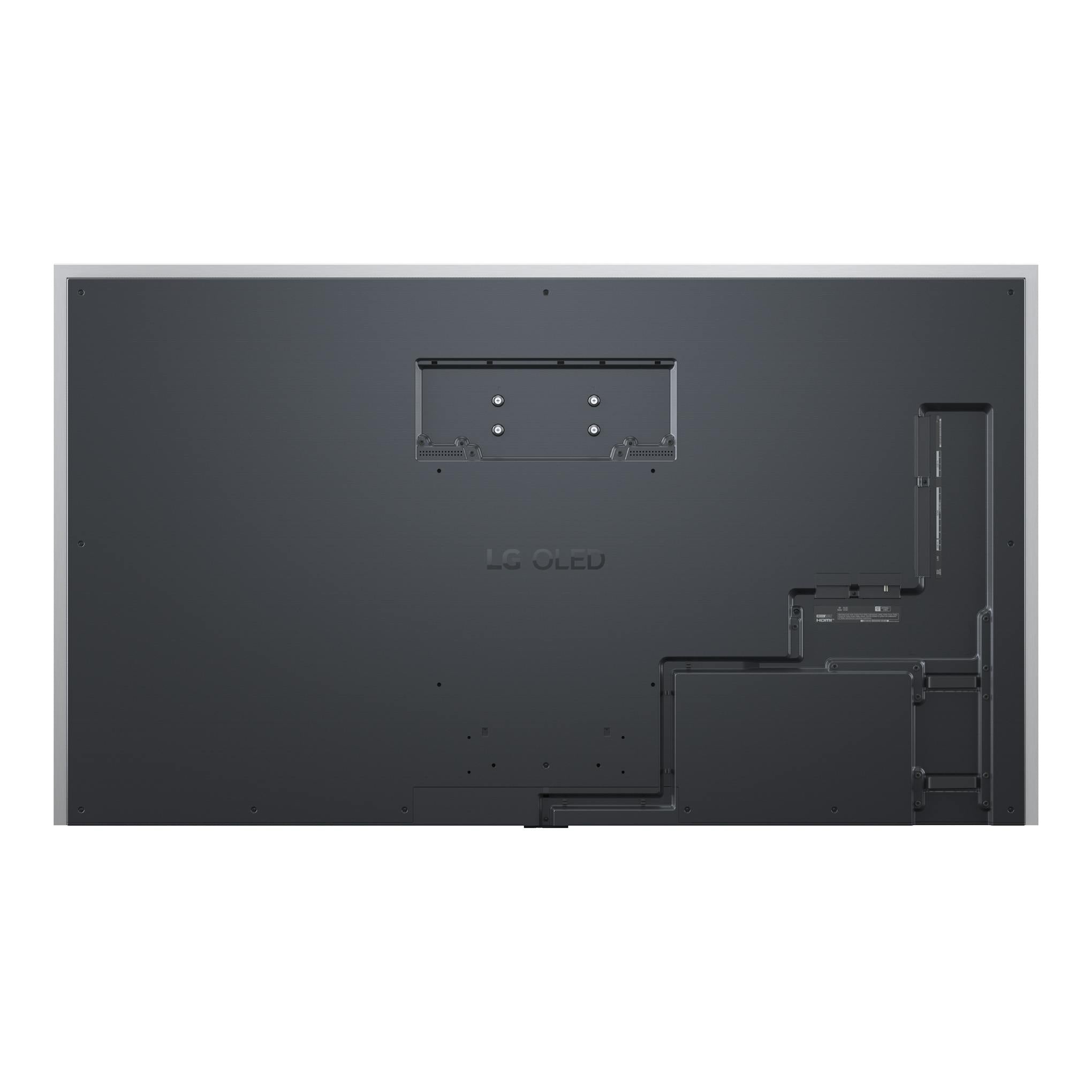 Vista trasera del televisor LG OLED83G64LW negro, con soporte VESA y conexiones laterales.
