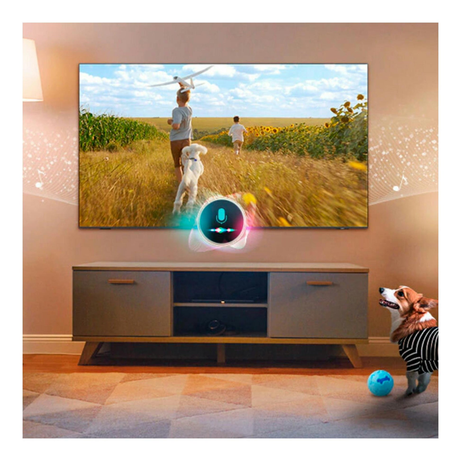 Televisor Samsung Neo QLED 4K montado en la pared, con imagen de niños en un campo, sobre mueble gris.