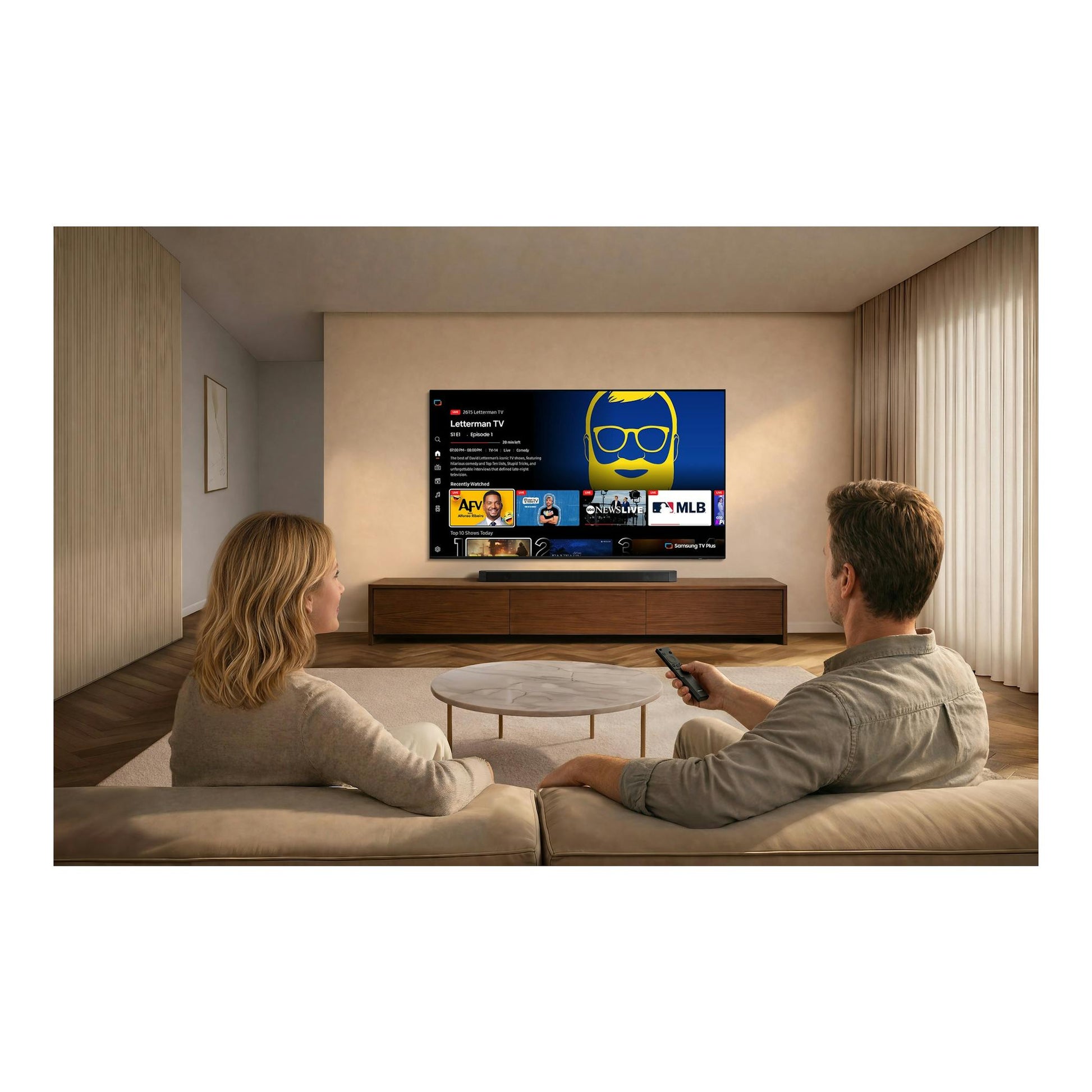 Televisor Samsung TU75U8075HUXXC, vista frontal, encendido en una sala sobre mueble de madera.
