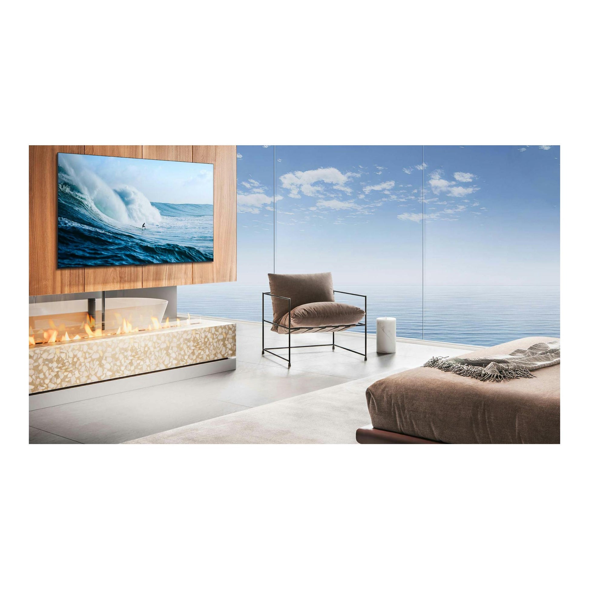 Televisor TCL 55C6K Pro montado en pared, vista frontal, con imagen de una ola en una sala moderna.